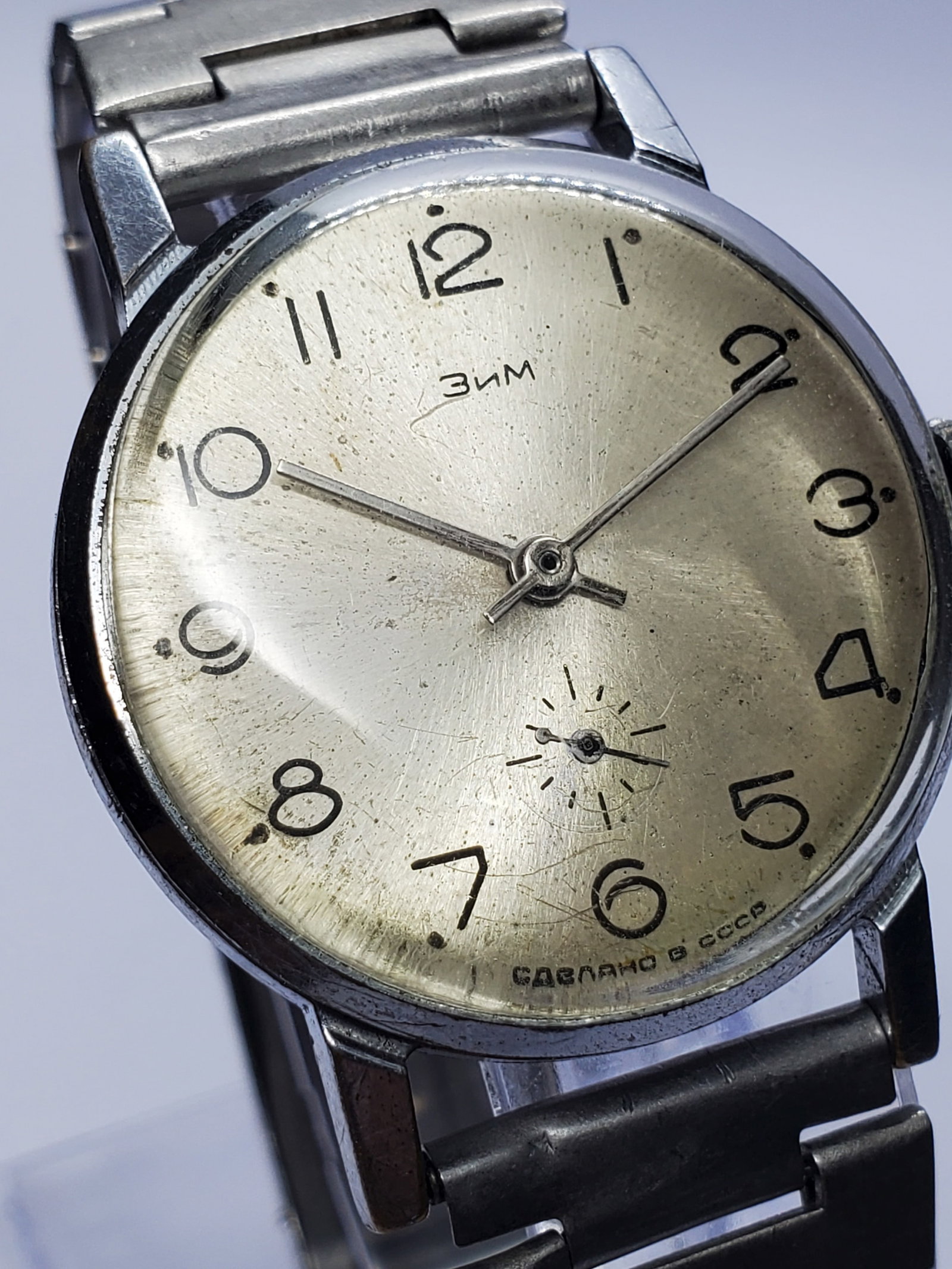 Vintage ZIM Pobeda USSR Sunburst Dial Manual Watch Classic 34mm, late 1960s, Running: This ZIM (Zavod Imeni Maslennikova) Pobeda Classic manual watch embodies understated elegance and Soviet-era durability, featuring a silver tone case paired with a light champagne silver dial enhanced