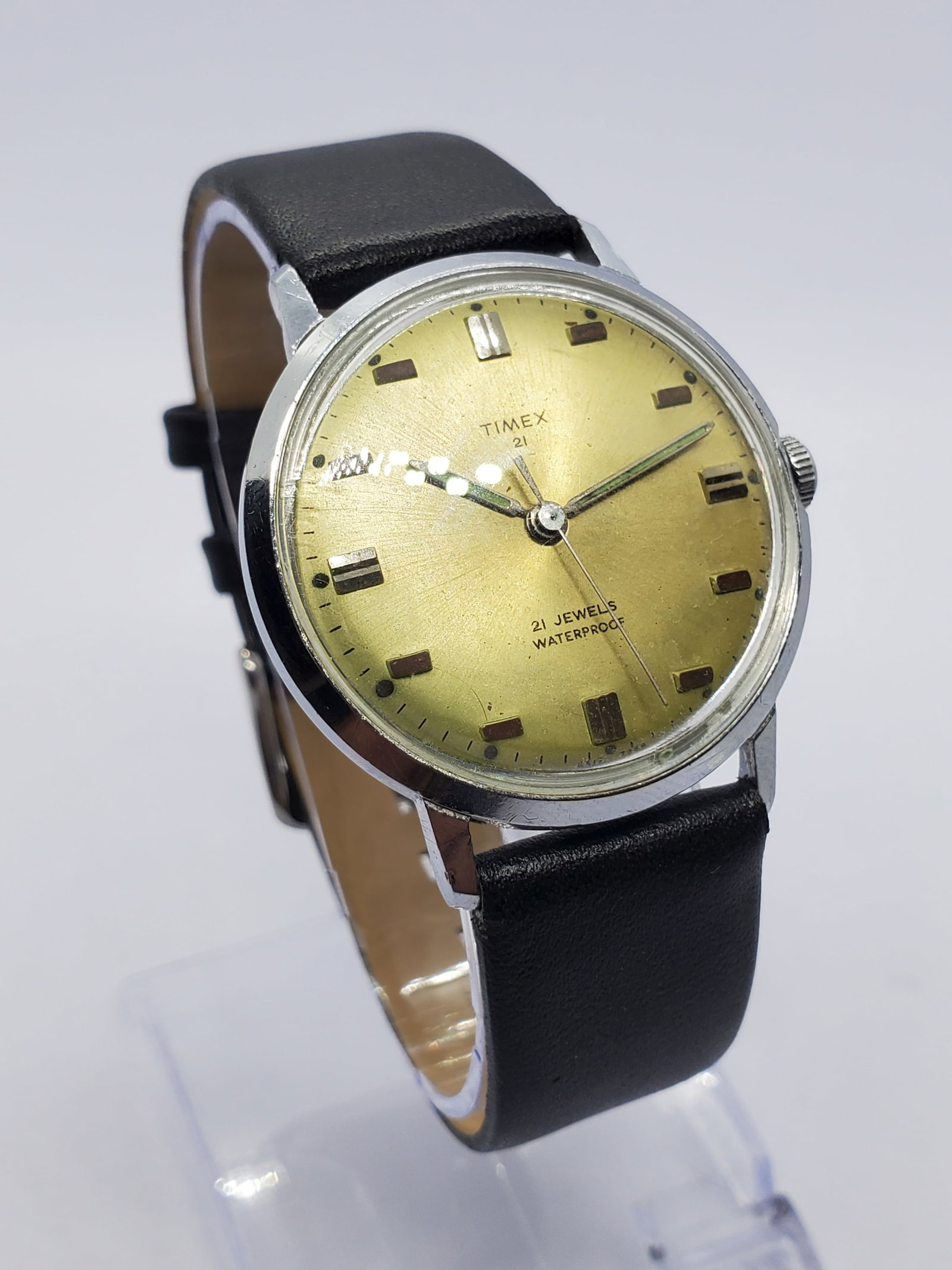 Vintage Mad Men Era Timex 21 Jewel Manual Champagne Dial Vintage Dress Watch, 1968, Running: This Timex 6517 7268 manual wind watch captures the refined elegance of the Mad Men era with its silver tone case and striking gold sunburst finish dial in a warm champagne tone, delivering a clean mi