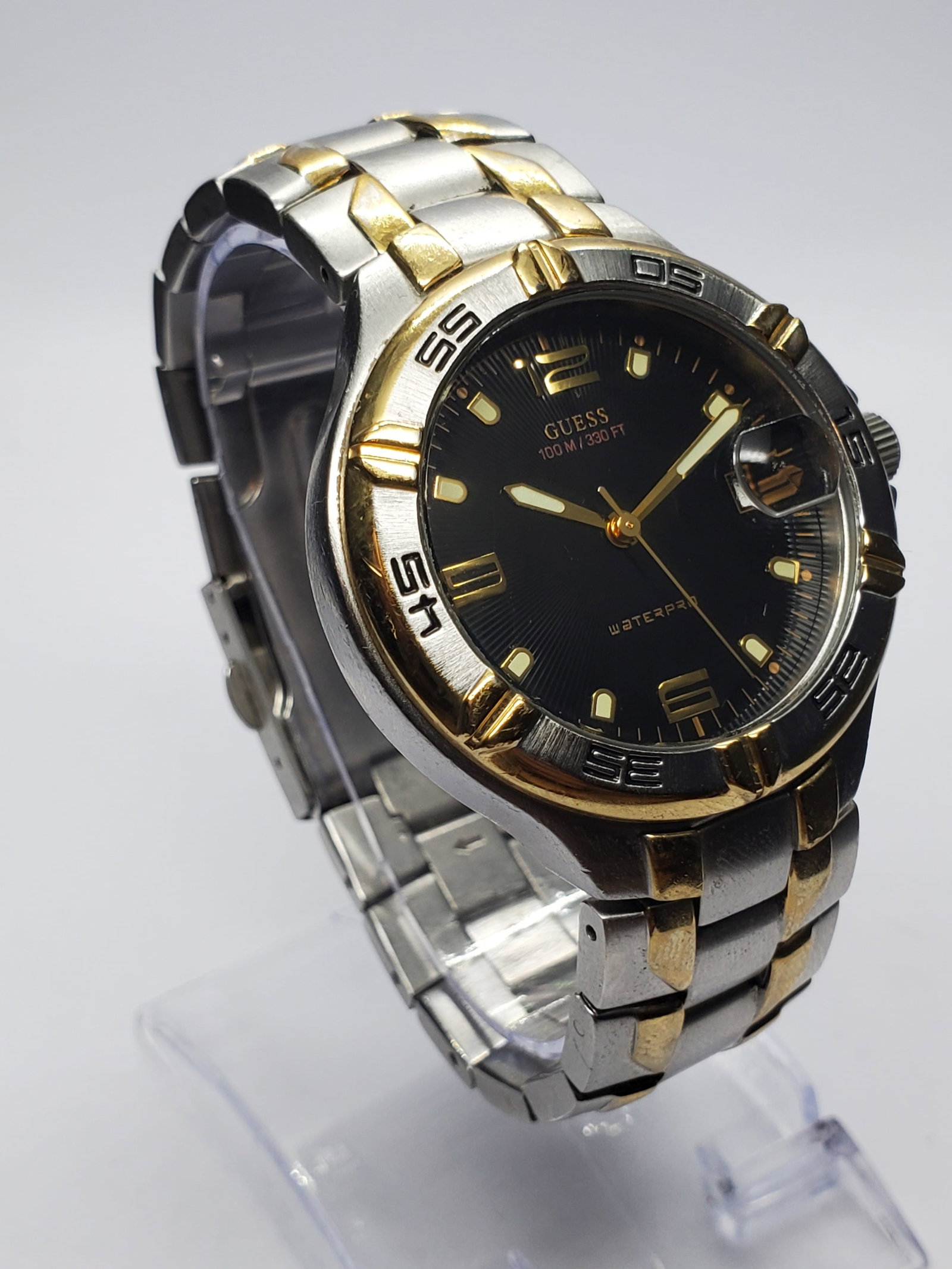 Vintage Guess Waterpro Dual Tone Sport Watch, 38mm, 2000s, Running: Make a bold statement with this Guess Waterpro G66036G quartz sport dress watch, a versatile designer timepiece combining athletic styling with upscale fashion appeal. Founded in 1981 in Los Angeles b