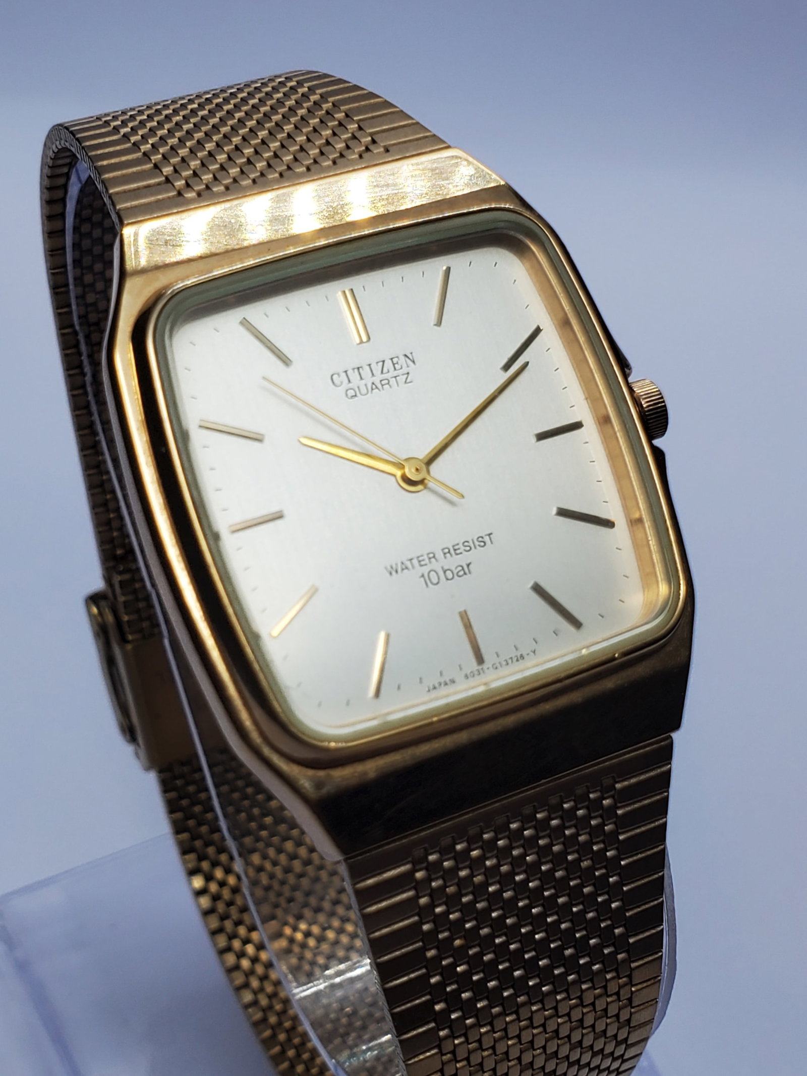 Vintage Citizen Classic Gold Plated Tank Watch, 29x35mm, 1984, Running: Elegant vintage Citizen Quartz model T4 G02646 featuring a refined gold plated tank case, brushed silver dial with gold tone markers and matching gold hands for a timeless minimalist appearance. The i