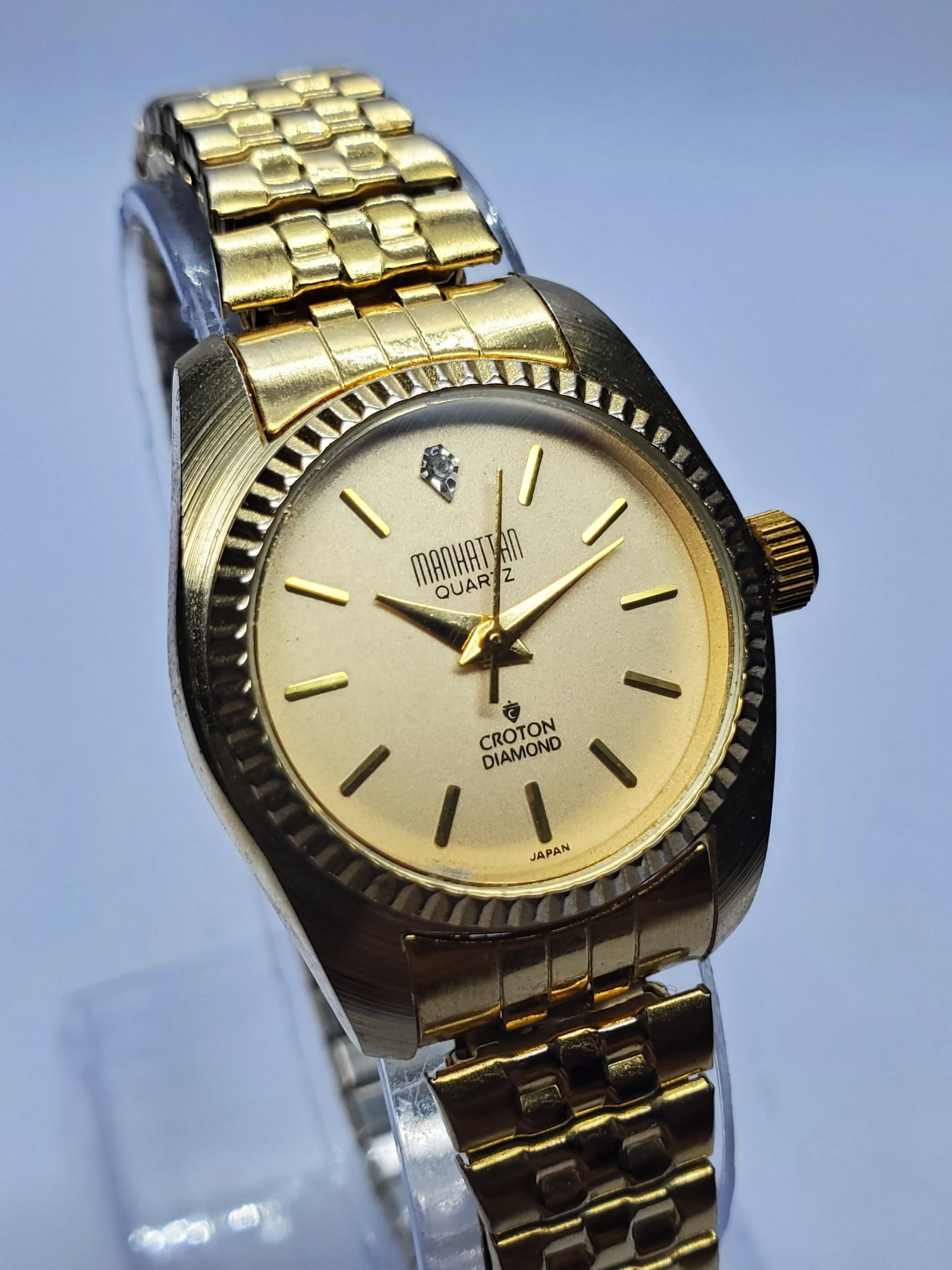 Vintage Croton Manhattan Quartz Diamond Gold Tone Dress Watch, 25mm, 1990s, Running: Refined vintage elegance defines this Croton Manhattan Quartz Diamond dress watch, a stylish statement piece from a brand with deep horological roots dating to 1878, when the Croton name became associ