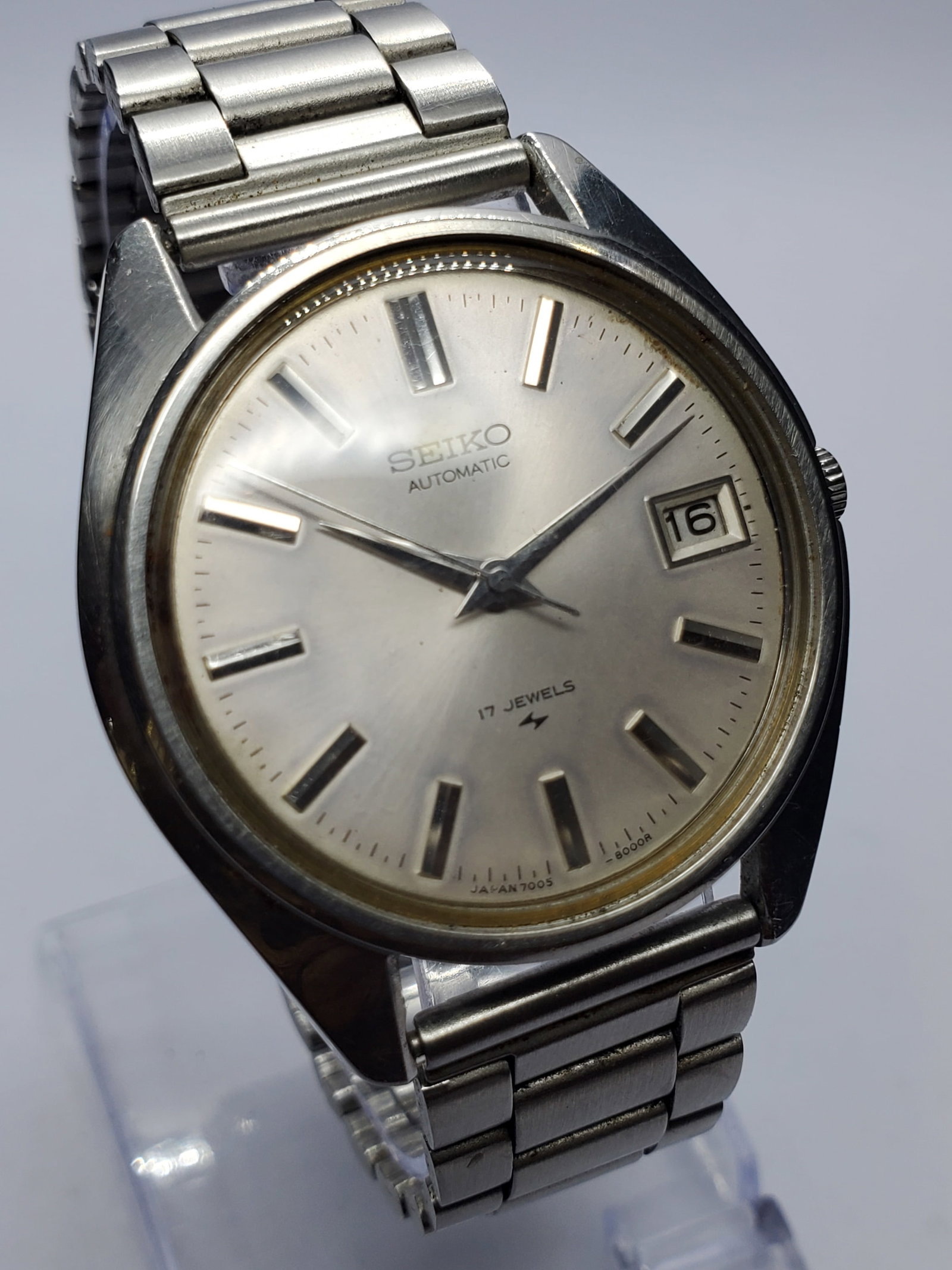 Vintage Seiko 7005-7030 Automatic 17 Jewels Silver Sunburst Dress Watch, 36mm, 1978, Running: Experience timeless Japanese craftsmanship with this vintage Seiko 7005-7030 Automatic dress watch, a refined classic from one of the world's most respected watchmakers. Founded by Kintaro Hattori in 