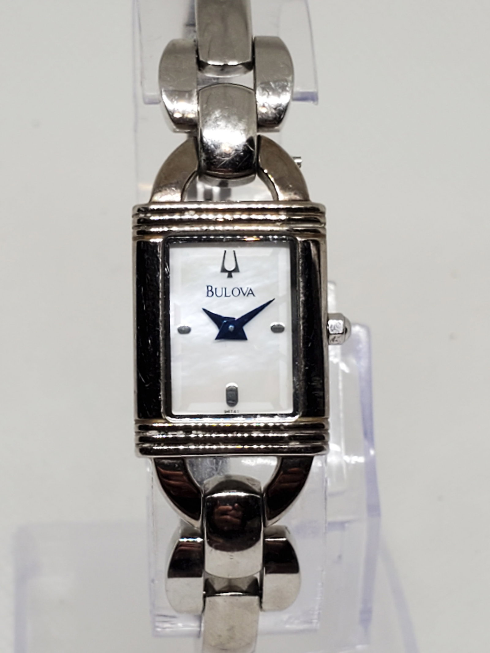 Vintage Bulova Mother of Pearl Ladies Watch, 2000s, Running: Elegance and prestige come together in this Bulova C8671211 dress watch, a refined piece designed for sophistication and everyday durability. Featuring a silver tone case with a radiant mother of pear