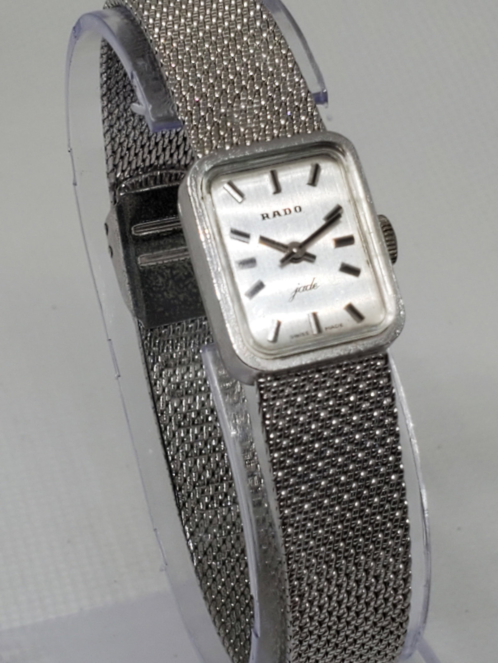 Vintage Rado Jade Silver Manual Watch, 1970s, Running: The Rado Jade (running) is a true testament to timeless elegance and Swiss craftsmanship. This luxury vintage timepiece features a sleek silver-tone case and dial, exuding a minimalist yet sophisticat