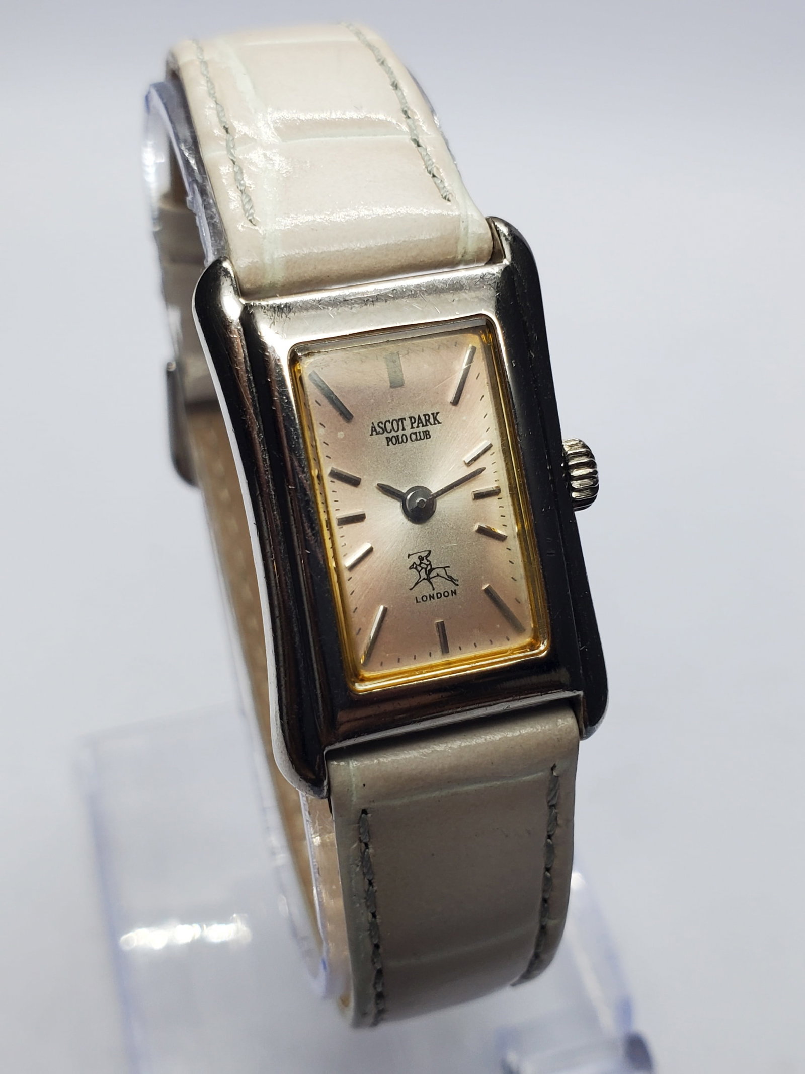 Vintage Ascot Park Polo Club London Tank Dress Watch, 18x24mm, 1990s, Running: Vintage Ascot Park Polo Club London Quartz dress watch featuring an elegant silver tone rectangular case and a beautiful silver champagne sunburst dial with a finely brushed radial finish that produce