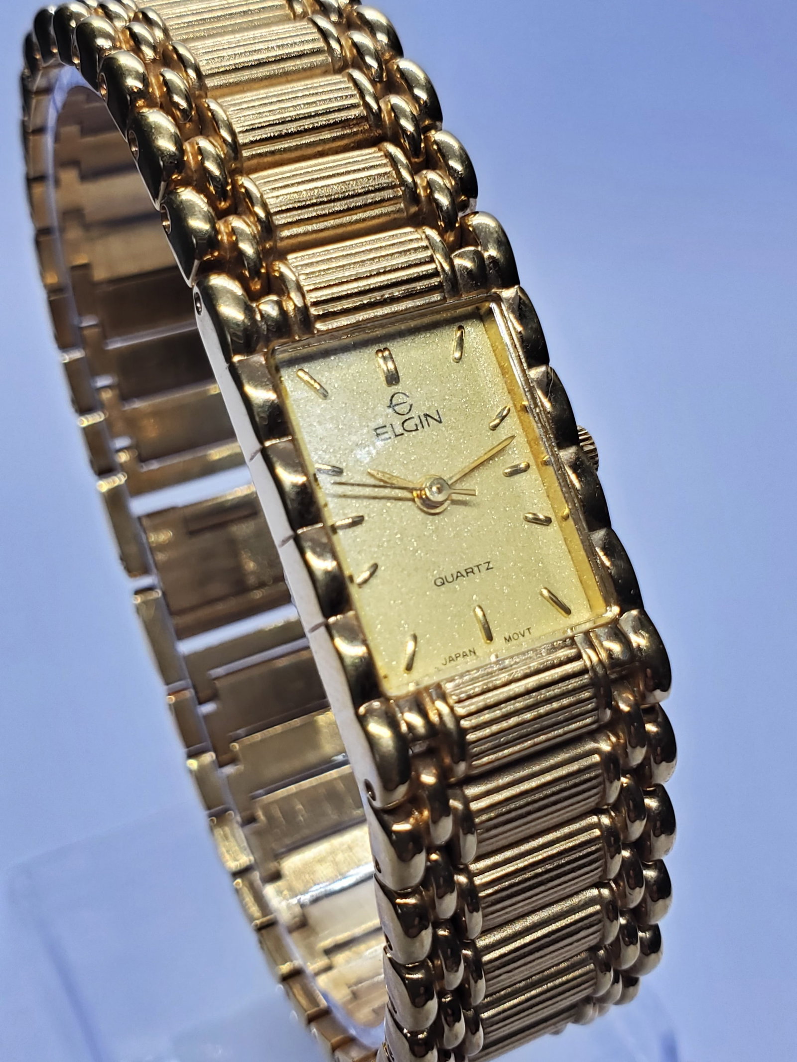 Vintage Elgin EM898-017 Gold Tone Tank Quartz Watch Elegant Dress Classic, 1990s, Running: A refined example of classic American watch styling, this Elgin EM898 017 quartz dress watch delivers timeless elegance with a gold tone tank case and a beautifully textured sanded gold dial accented 