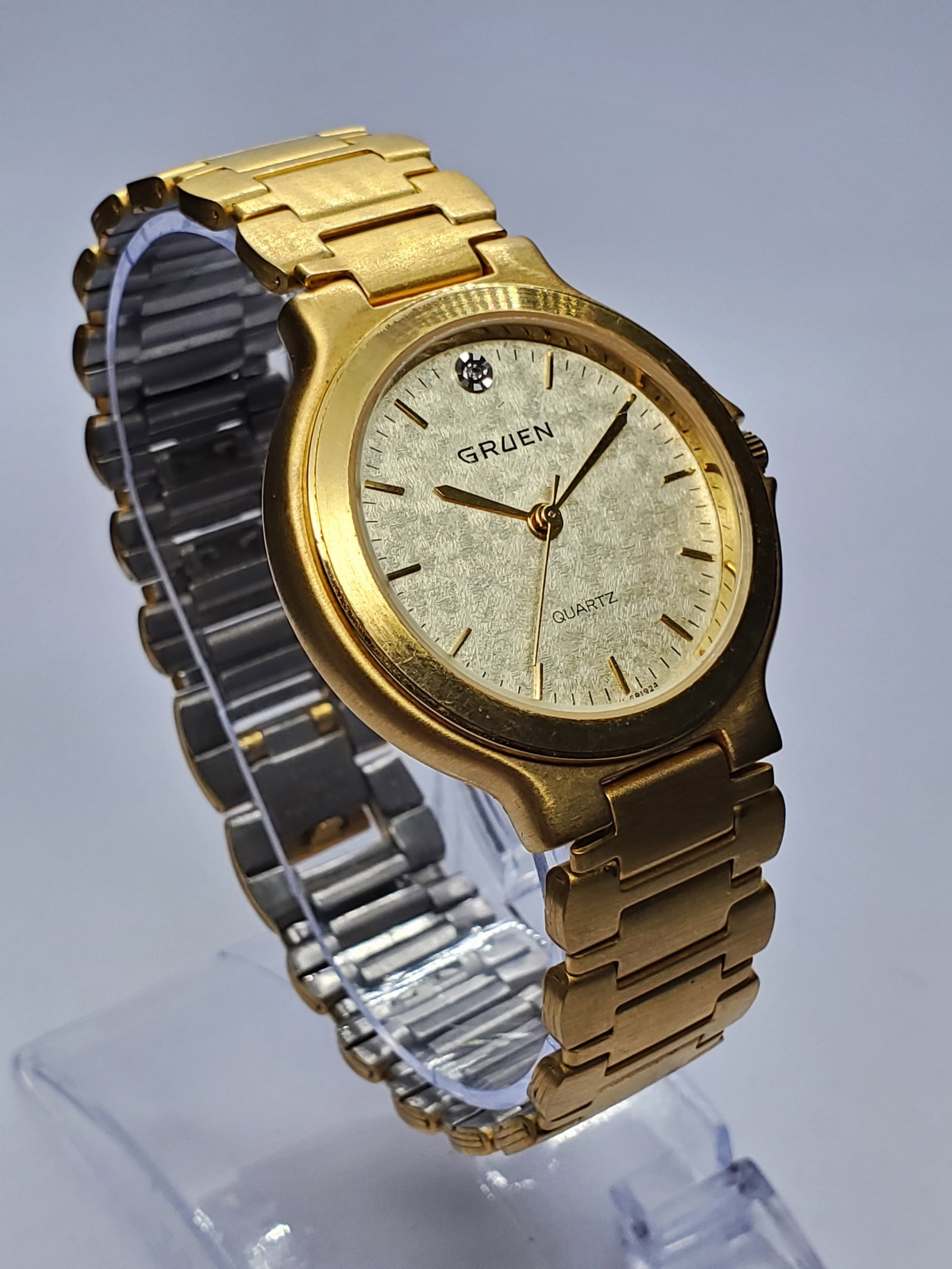 Vintage Gruen Gold Tone Diamond Marker Dress Watch, 34mm, 1990s, Running: Founded in 1894 in Cincinnati, Ohio by Dietrich Gruen, Gruen earned a respected place in American horology for combining elegant styling with dependable timekeeping, becoming a favorite among collecto