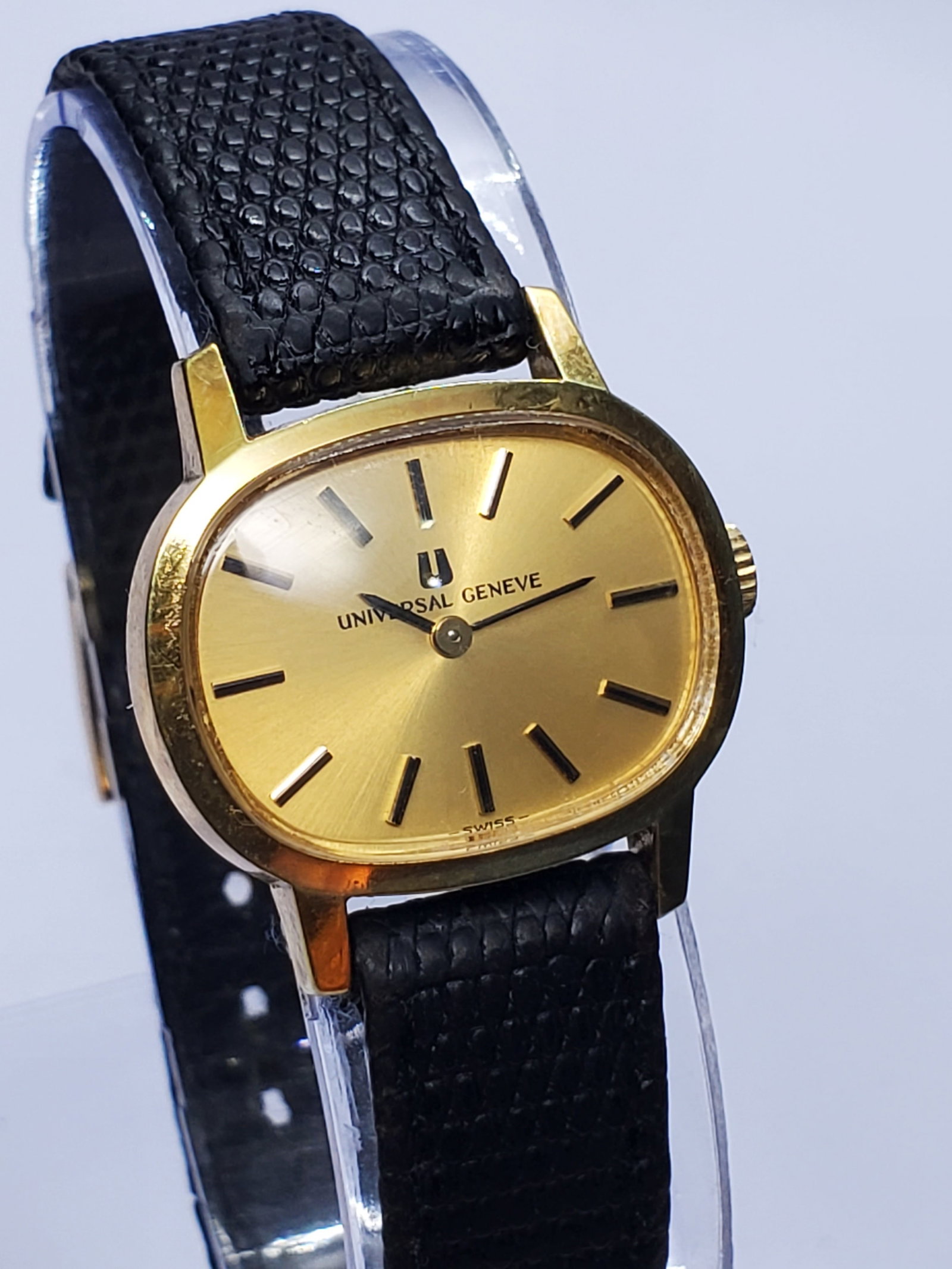 Vintage Universal Geneve Classic Gold Dial Manual Dress Watch Swiss, 1971 to 1973, Running: This elegant Universal Geneve Classic manual wind dress watch represents the refined Swiss craftsmanship that made the brand one of the most respected names in horology. Founded in 1894 by Ulysse Perr