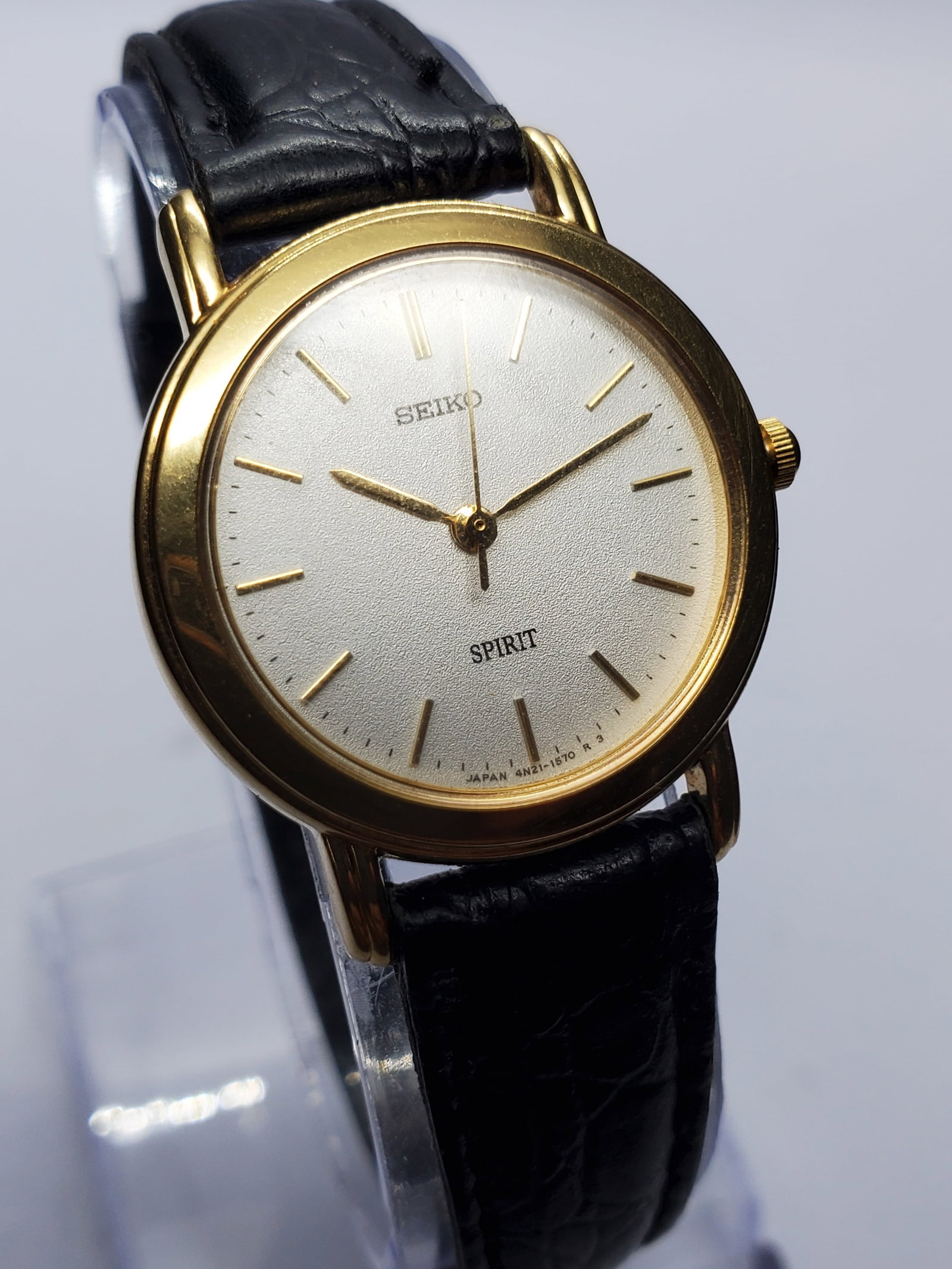 Vintage Seiko Spirit Gold Tone Dress Watch, 26mm, 1993, Running: Discover timeless Japanese elegance with this vintage Seiko Spirit 4N21 0810 quartz dress watch. Founded in 1881 by Kintaro Hattori in Tokyo, Japan, Seiko has earned worldwide respect for innovation, 