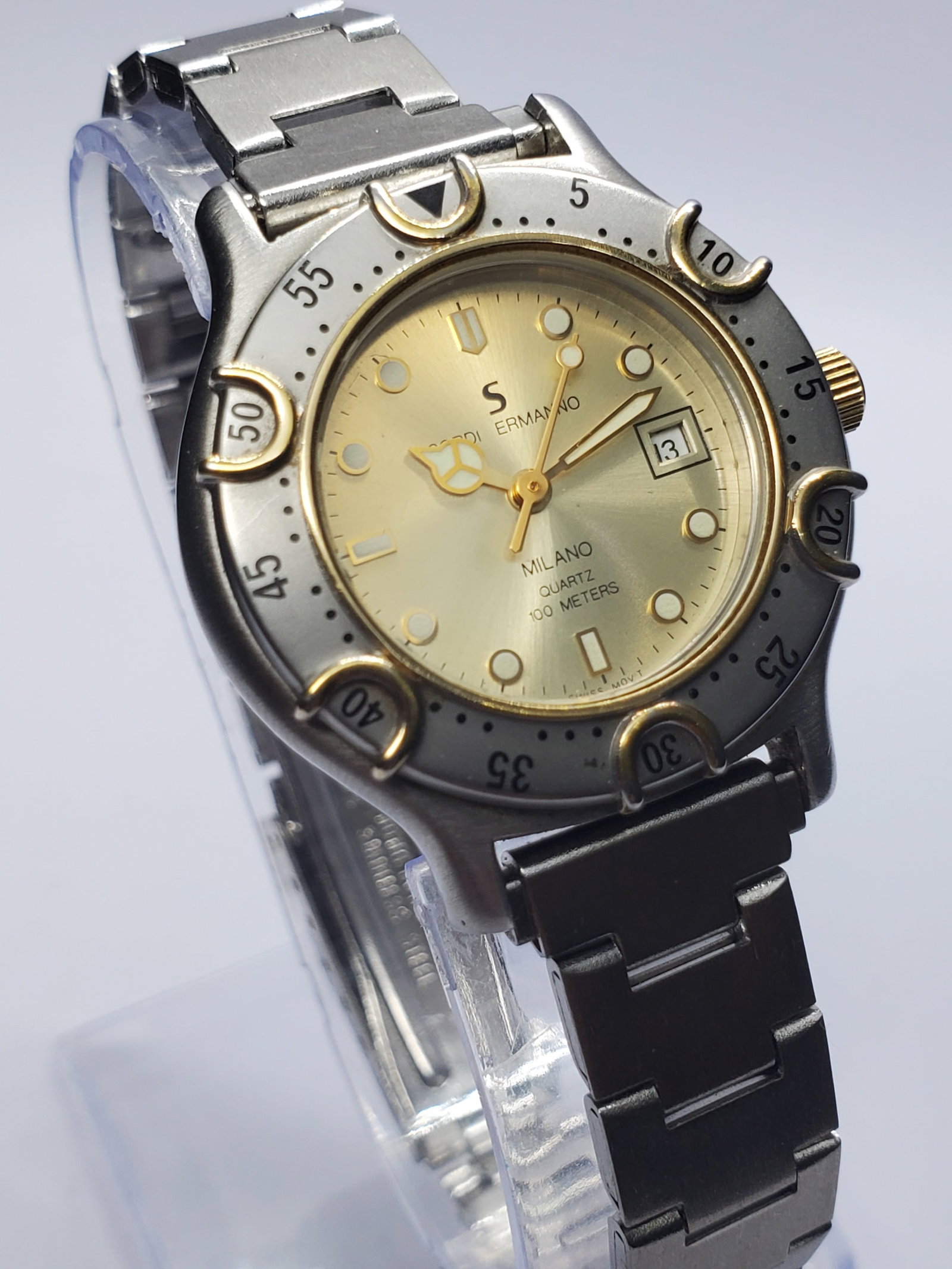 Vintage Sordi Ermano Milano Diver Quartz Two Tone 100M Watch, 30mm, 1990s, Running: Discover the refined Italian flair of Sordi Ermano Milano, a lesser known yet stylish brand associated with Milan?s fashion driven watch design culture that emerged in the late twentieth century. This