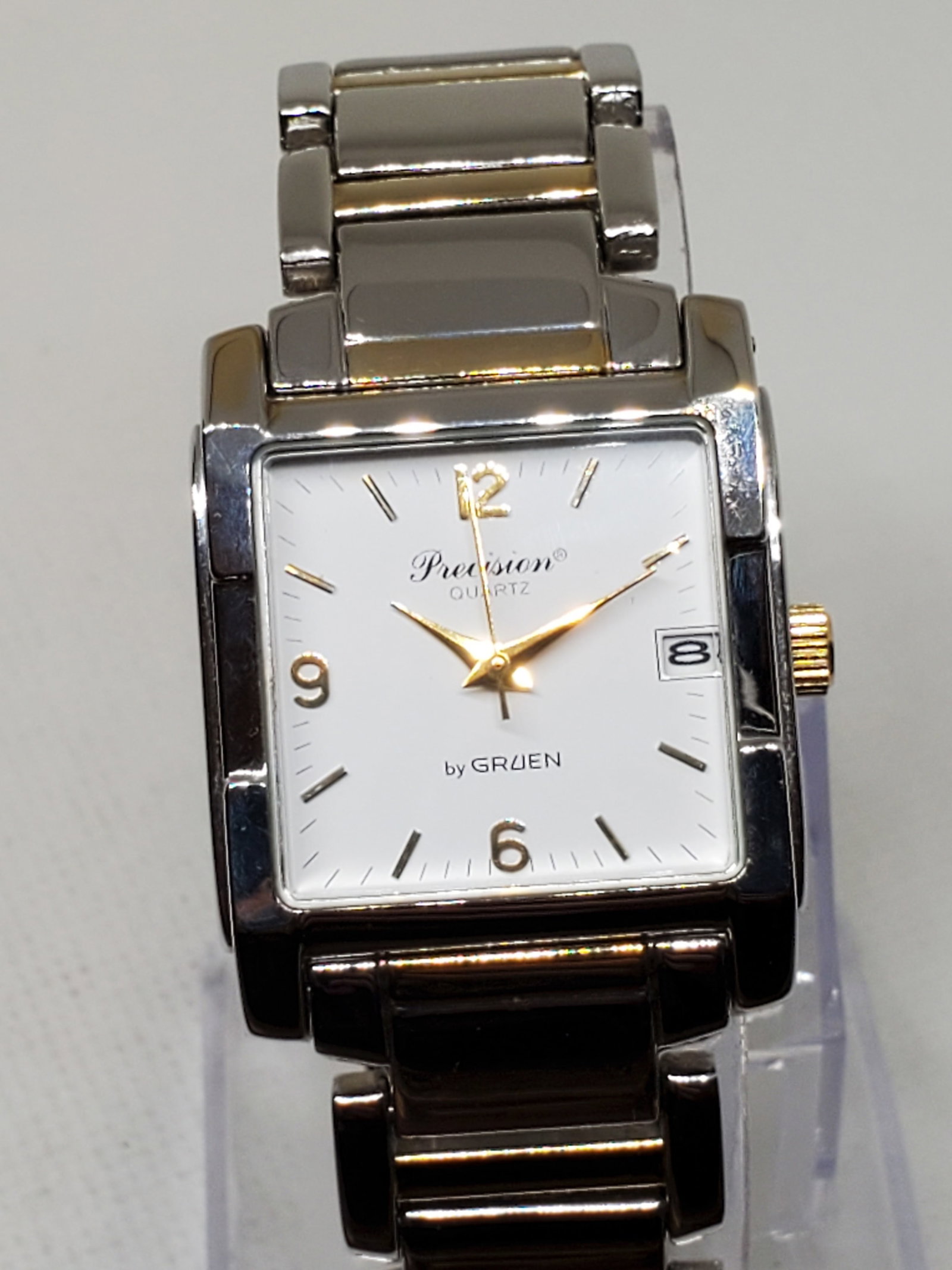 Vintage Gruen Precision Silver Tone with Gold Plated Accents Watch, 1990s, Running: Add a touch of timeless elegance to your collection with the Gruen Precision GR5033, a refined dress watch that blends classic sophistication with modern functionality. Featuring a 28mm silver-tone ca
