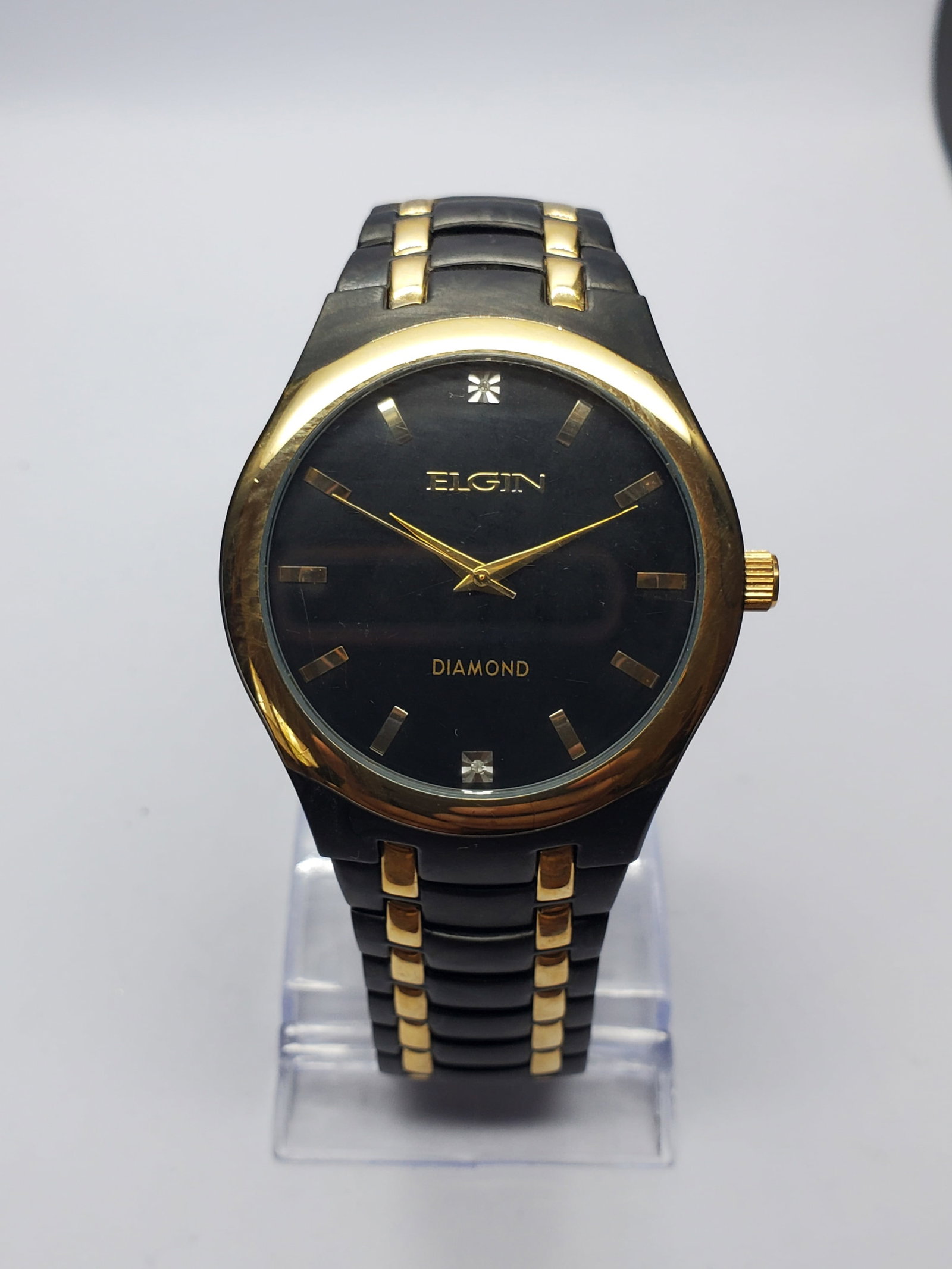 Vintage Elgin Diamond Black Dial Gold Bezel Watch, 42mm, 2000s, Running: Elevate your collection with this sophisticated Elgin FG8021 Diamond quartz dress watch, a striking blend of classic elegance and modern styling. Founded in 1864 in Elgin, Illinois, Elgin became one o