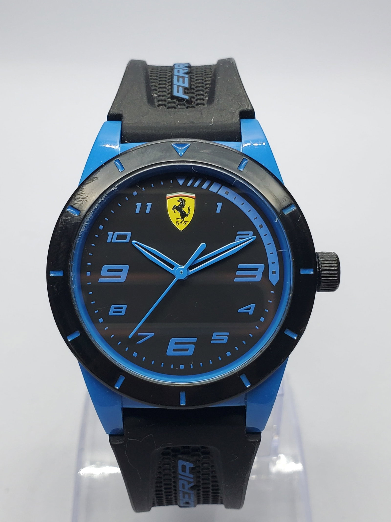 Scuderia Ferrari Blue Quartz Racing Watch 34mm, 2010s, Running: Sporty Scuderia Ferrari SF.27.0.47.0497 quartz watch featuring a 34 mm blue composite case, contrasting black bezel, black dial with vivid blue numerals and hands, iconic Prancing Horse shield, and a 
