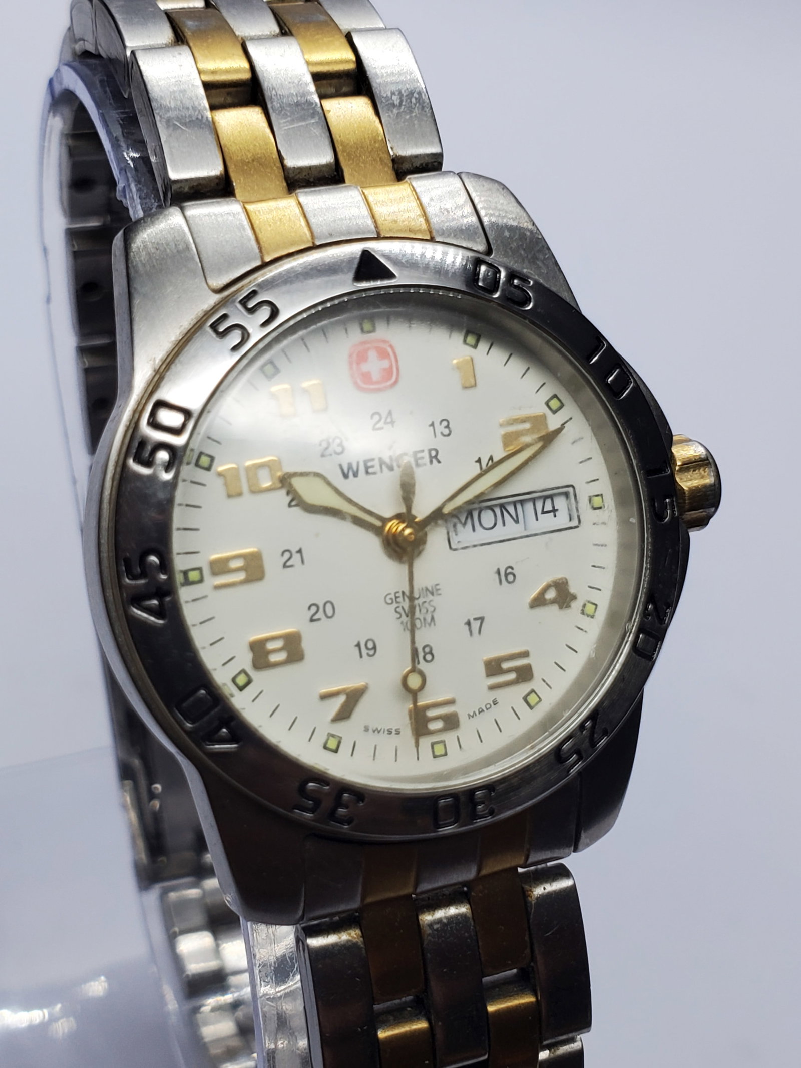 Vintage Wenger Dual Tone Watch, 29mm, 2000s, Running: Classic Swiss craftsmanship meets everyday elegance in this Wenger 091.0930 quartz watch. Founded in 1893 in Del?mont, Switzerland, Wenger earned worldwide recognition for producing the genuine Swiss 