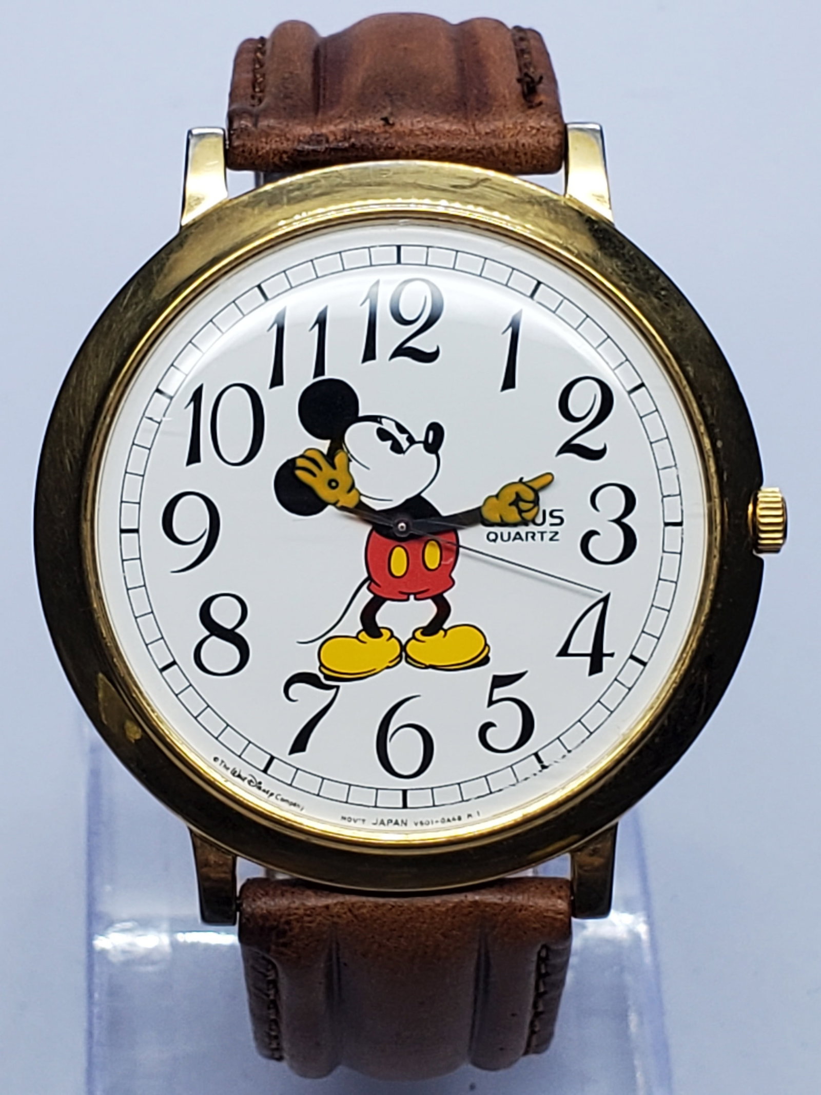 Vintage Lorus Disney Mickey Mouse Watch, 44mm, 1990s, Running: Vintage Lorus Disney Mickey Mouse V501-0A20 quartz watch combining cheerful character styling with bold casual elegance. Its oversized 44 mm gold-plated base-metal case frames a crisp white dial with 
