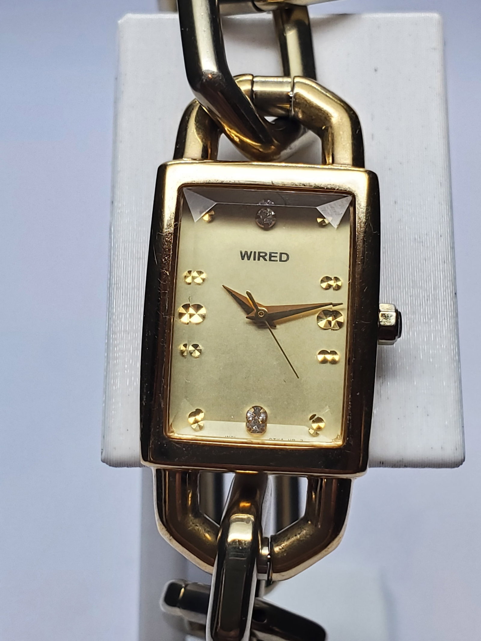 Seiko Wired Gold Tone Cut Glass Bracelet Watch, 19x25mm, 2000s, Running: Seiko Wired is Seiko fashion forward Japanese sub brand, introduced in 2000 to combine innovative design with Seiko?s renowned precision and reliability. Founded by Kintaro Hattori in 1881 in Tokyo, J