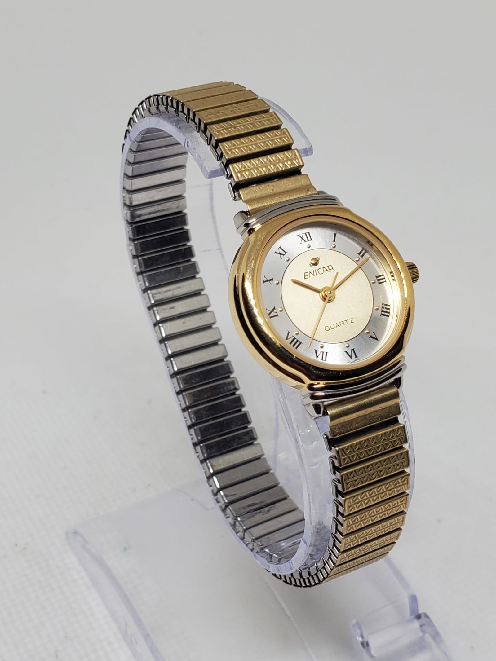 Vintage Enicar Swiss Quartz 596.371L Gold Plated Ladies Watch Roman Numerals 24mm, 1990s , Running: This elegant Enicar 596.371L ladies watch showcases the refined Swiss craftsmanship that has defined the brand since its founding by Ariste Racine in La Chaux de Fonds in 1913. Enicar is celebrated fo