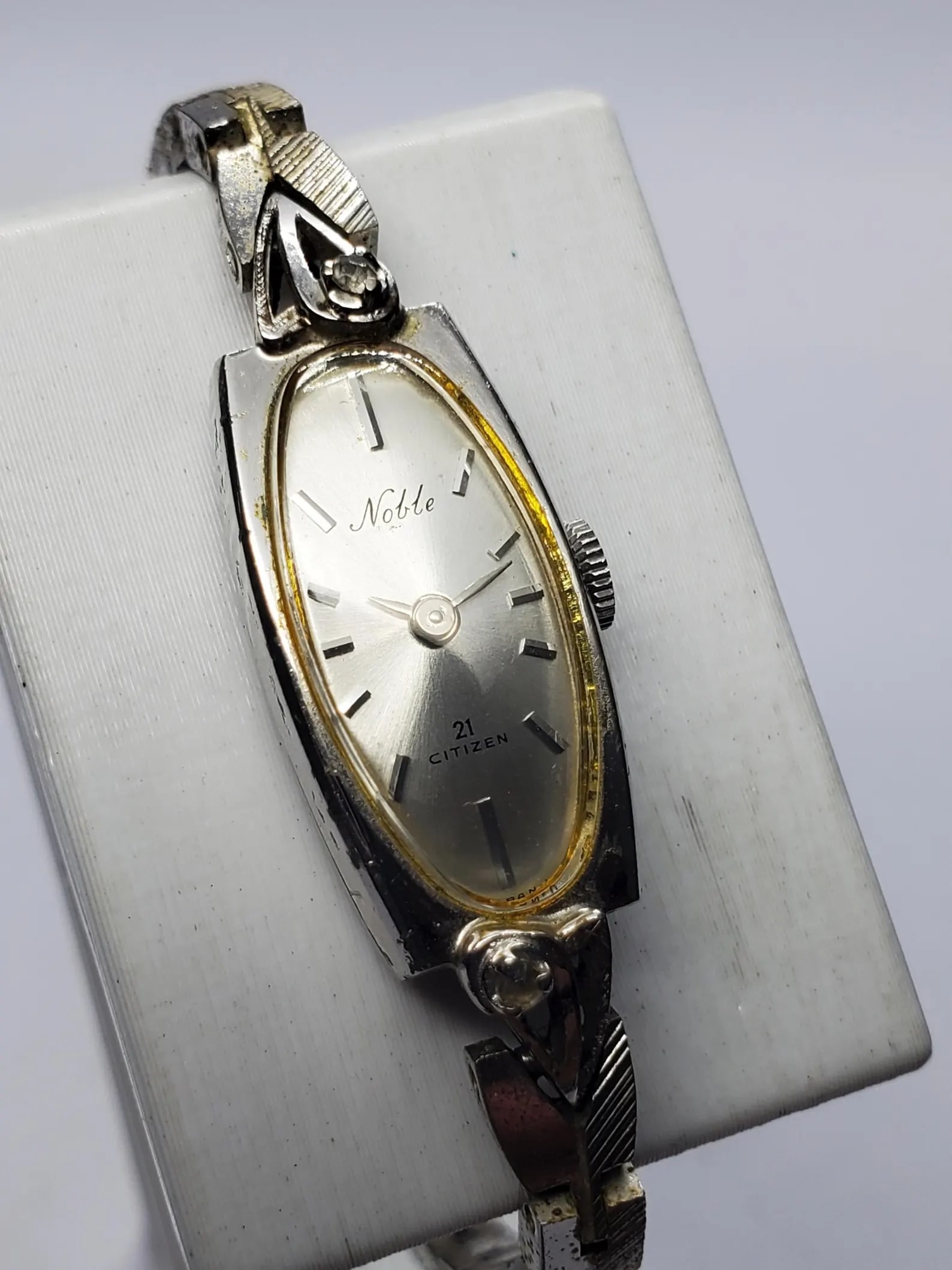 Vintage Citizen Noble 21 Jewels Silver Dial Manual Dress Watch, 12x24mm, 1960s, Running: Experience timeless Japanese craftsmanship with this vintage Citizen Noble manual wind dress watch, an elegant timepiece admired for its refined styling and dependable mechanical movement. Founded by 