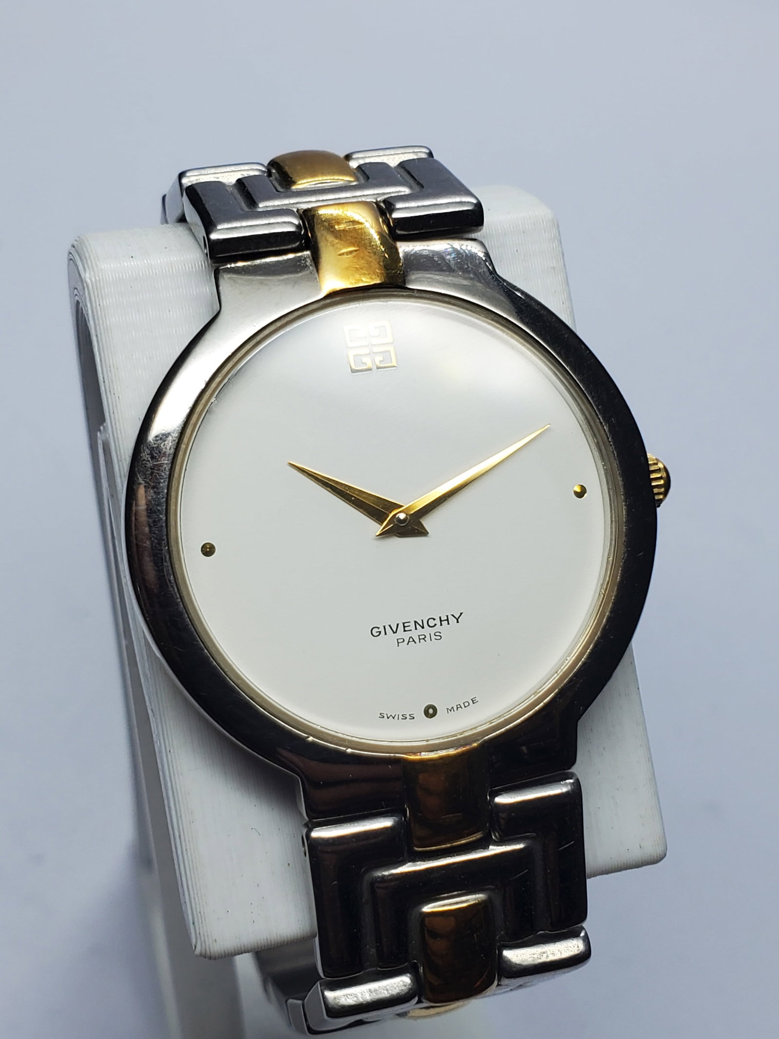 Vintage Givenchy Capitol Dual Tone Quartz Swiss Dress Watch, 32mm, 1990s, Running: Discover timeless Parisian elegance with this Givenchy Capitol Swiss Quartz dress watch, a refined luxury accessory from one of France?s most celebrated fashion houses. Founded by Hubert de Givenchy i