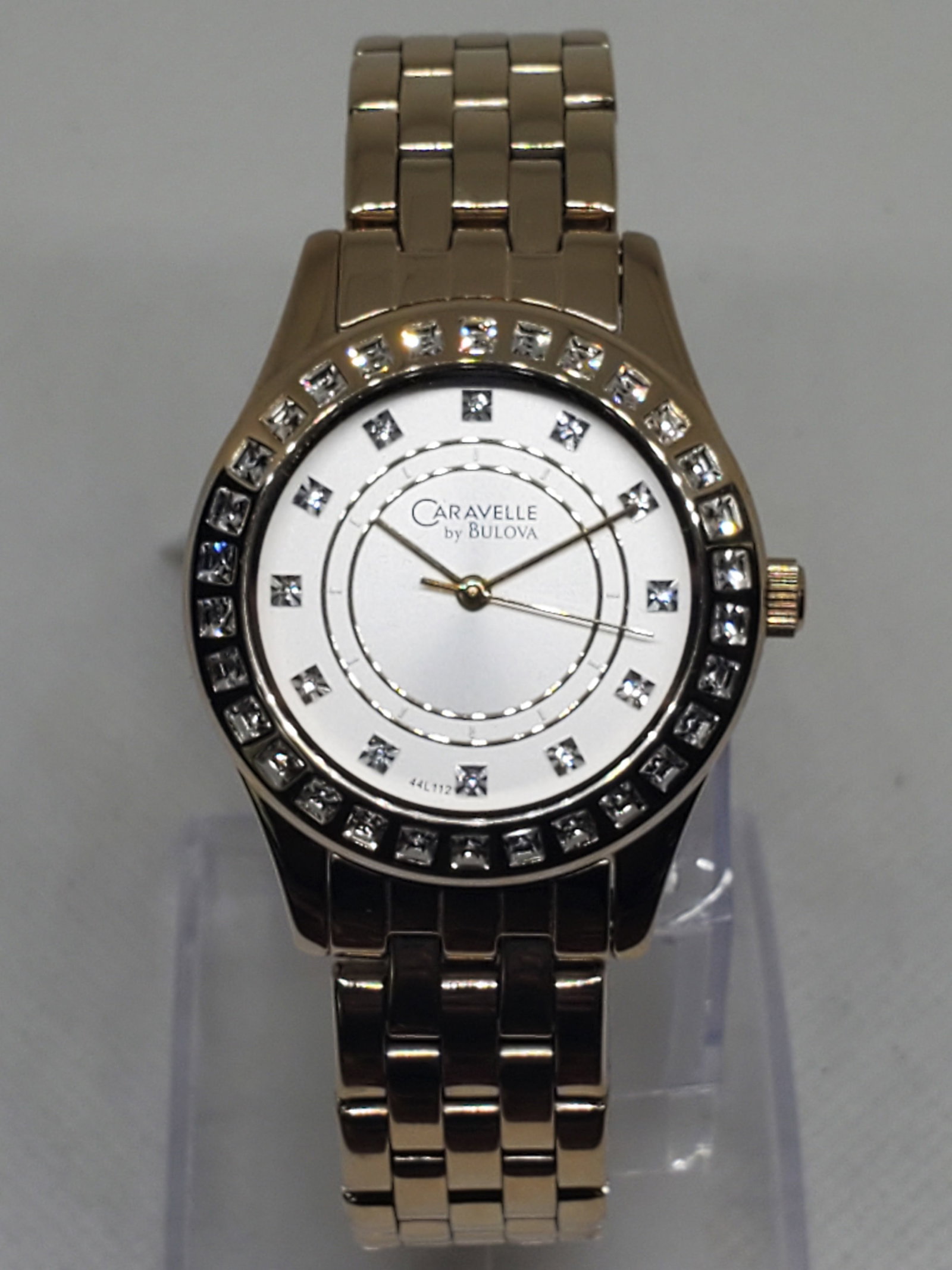 Vintage Bulova Caravelle Crystal Bezel Unisex Watch With Box, 2010, Running: Bulova Caravelle C7691104 Quartz Dress Watch Crystal Bezel Elegance A stunning blend of elegance and refinement, this Bulova Caravelle C7691104 is designed to complement any sophisticated wardrobe. Fe