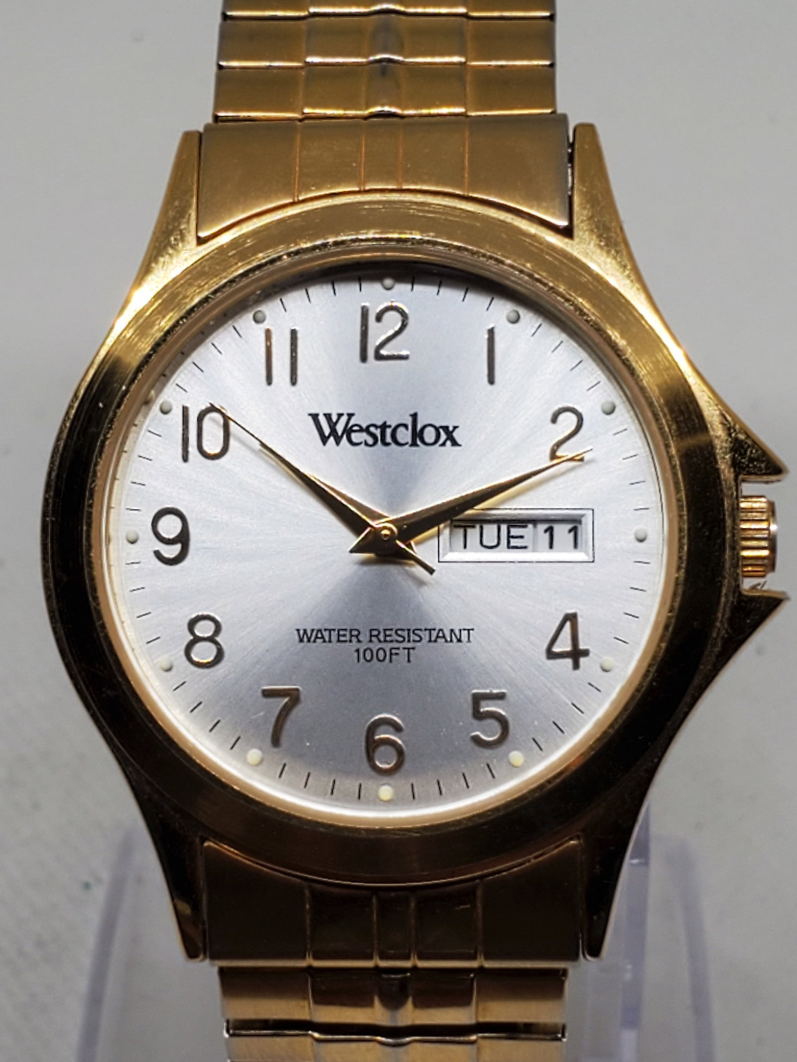 Vintage Westclox WX118 Gold Tone Quartz Watch with Box Day Date, 1990s, Running: This elegant vintage Westclox WX118 quartz wristwatch embodies timeless sophistication and reliability. Featuring a radiant gold plated case paired with a refined sunburst silver dial, it displays bot