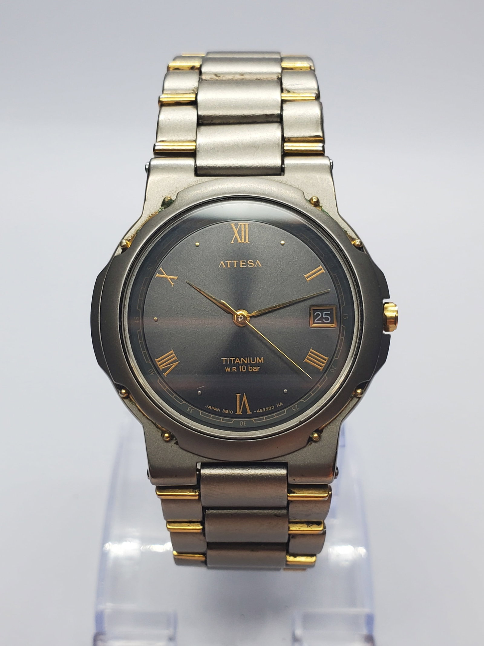Vintage Citizen Attesa Titanium Gray Sunburst Watch, 34mm, 1991, Running: Experience the refined elegance of the Citizen Attesa 3810-451694 Quartz dress watch, a premium Japanese timepiece that combines advanced titanium construction with timeless styling. Founded by Citize
