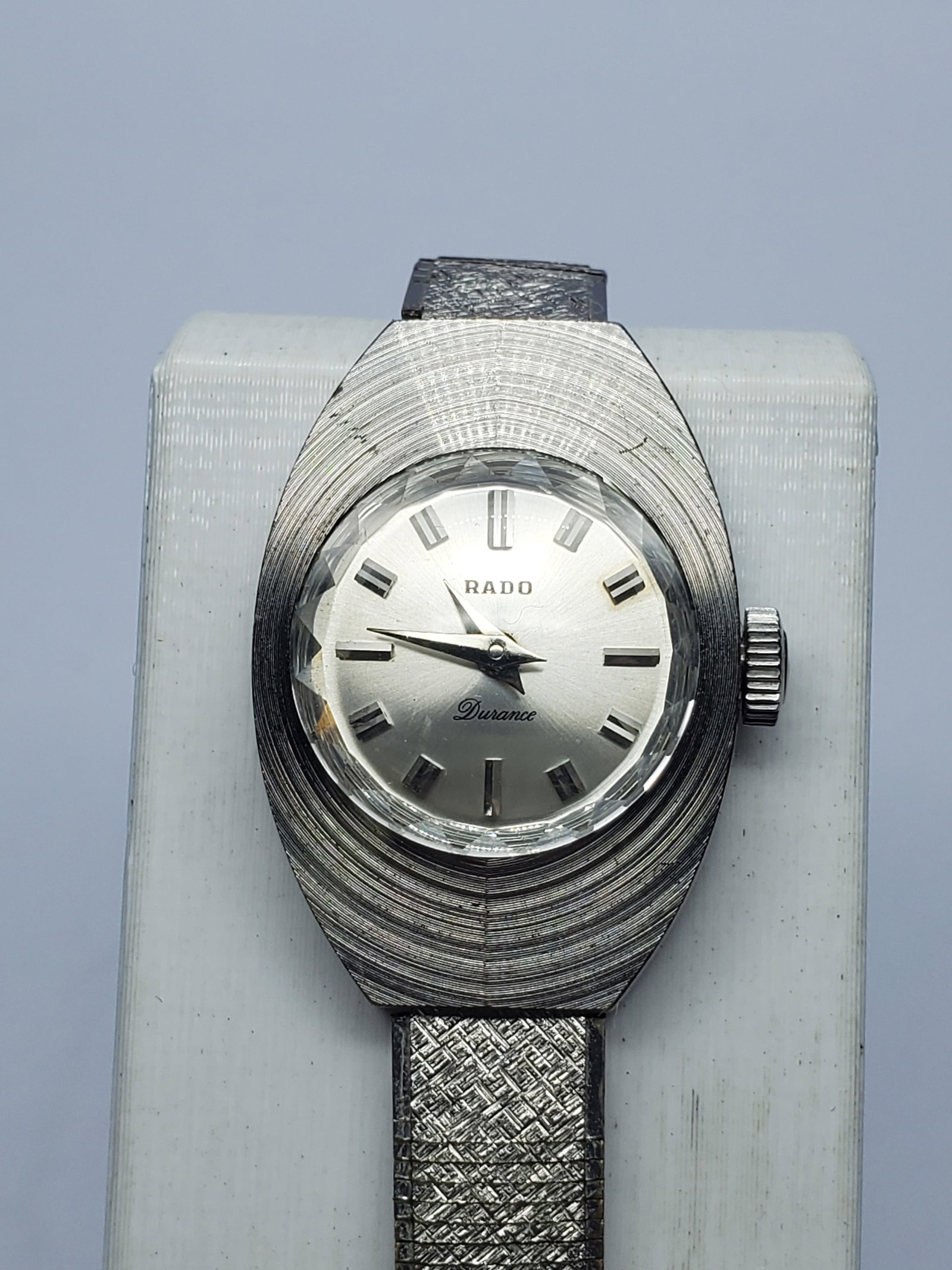 Vintage Rado Durance Ladies Manual Dress Watch, 19x27mm, circa 1970, Running: Discover distinctive mid-century elegance with this vintage Rado Durance ladies? dress watch, estimated circa 1970. Its sculptural 19 mm x 27 mm silver-tone case, faceted crystal, silver dial, applied