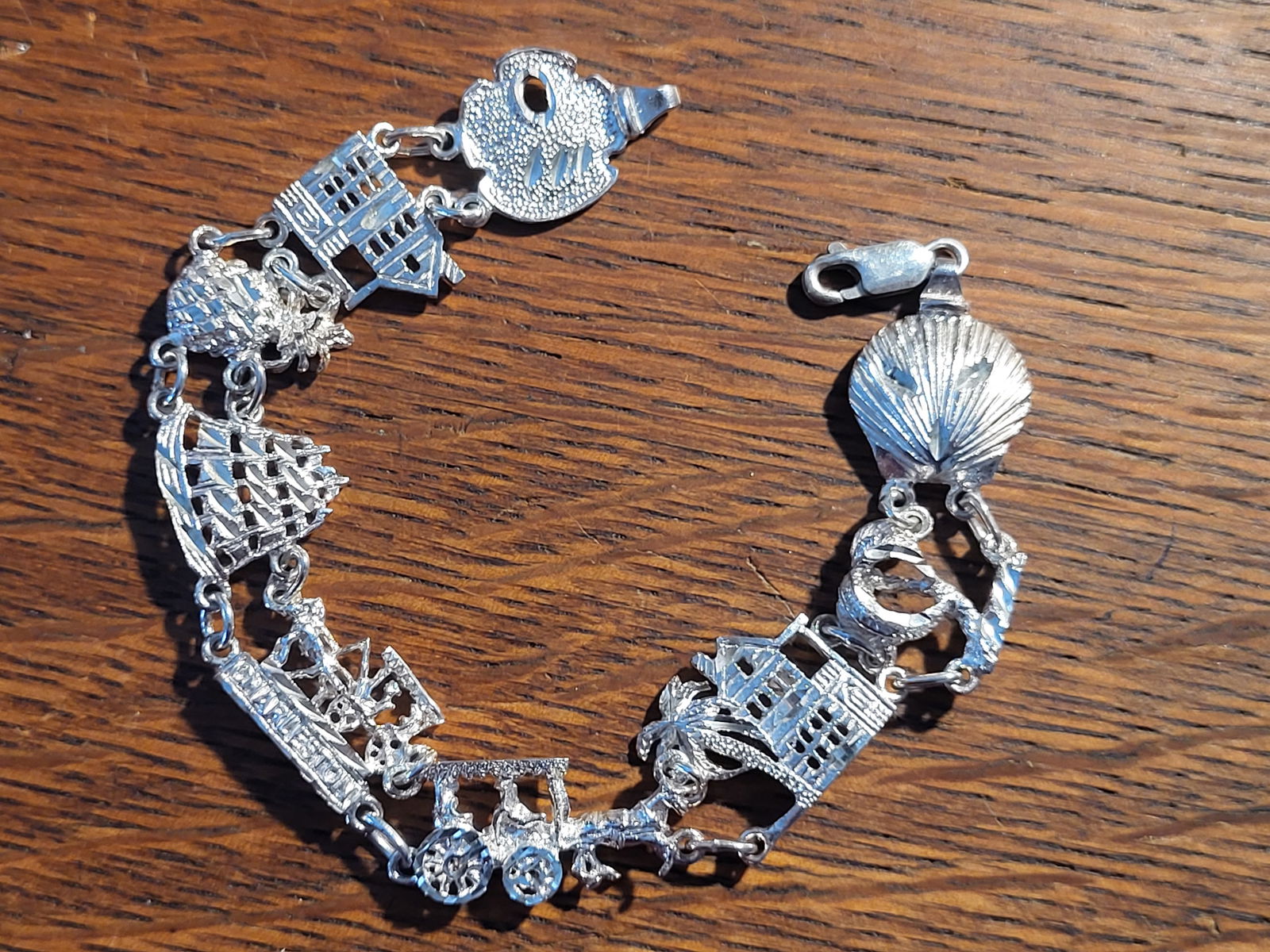 Charleston SC-Themed Historic Landmarks Bracelet: Cast in: Sterling Silver .925 Length: 7" Closure: Lobster Clasp If you are from Charleston SC, or simply have wonderful memories of a visit to this historic southern city, this