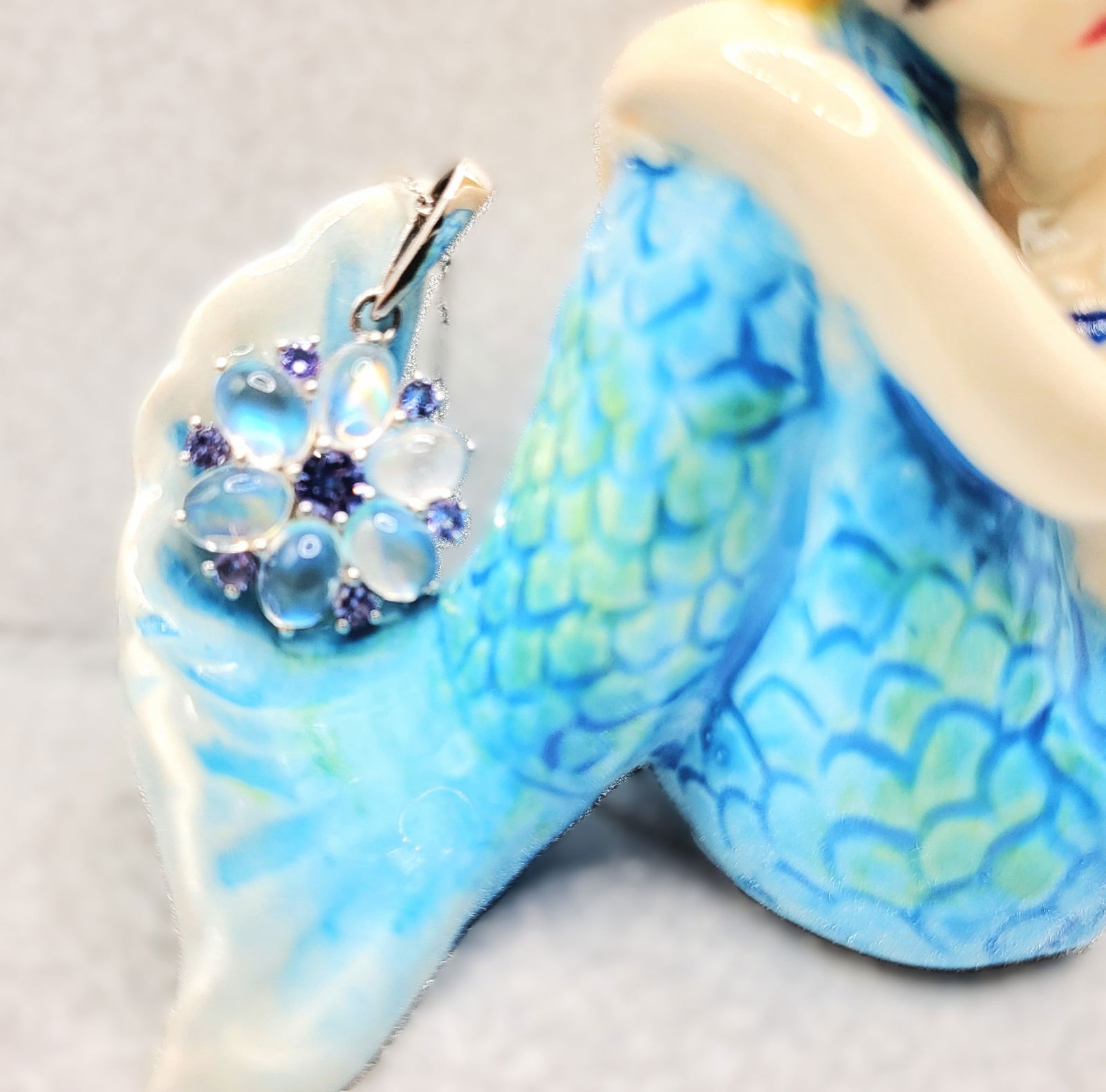 Rainbow Moonstone and Tanzanite Necklace: Setting: Sterling Silver .925 Primary Gemstone: Rainbow Moonstone Secondary Gemstone:Tanzanite (Zoisite) Link Style: Fine, Open Link Closure: Spring Ring