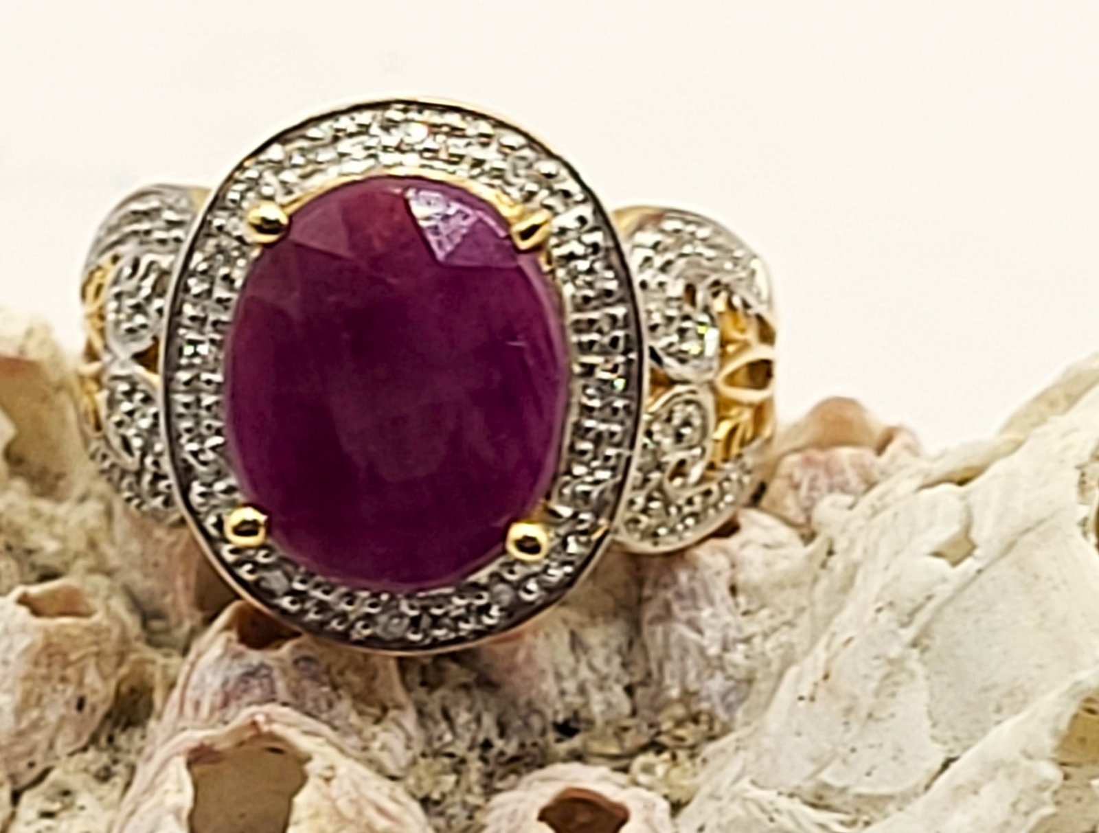 Bold And - Or Chunky Ruby and Diamond Swirl Ring: Setting: 14K Yellow Gold (with rhodium accents) Main Gemstone: Genuine Ruby Adjacent Gemstone: Genuine, Natural Diamond Size: US 7 Weight: 7.55g Whether you think this ring is 'bold