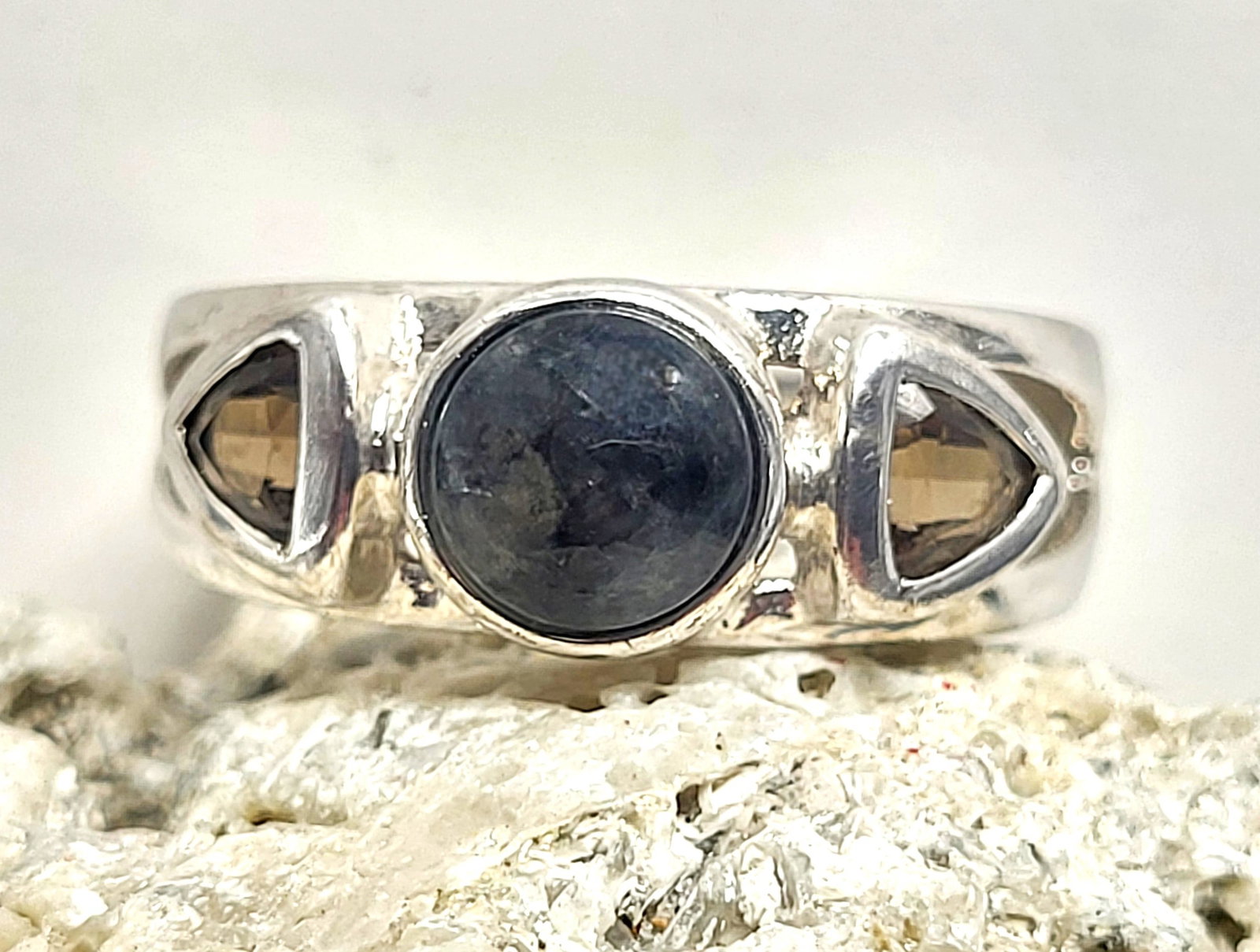 Man's Ring with Amethyst and Citrine .925: 800012 Setting: Sterling Silver .925 Main Gemstone: Quartz (Amethyst and Smoky Quartz) Size: 9.5 Weight: 6.53g Birthstone for: FEBRUARY All three stones test as quartz, the trilliant are brown (aka: s