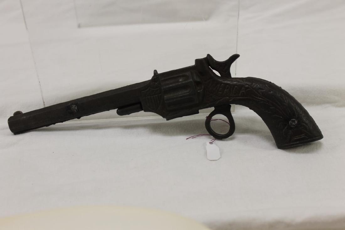 Stevens "America" cast iron cap gun, c. 1880, 8 3/4",: Stevens "America" cast iron cap gun, c. 1880, 8 3/4", Patd. 1873, Apr. 22, with rare ring trigger.