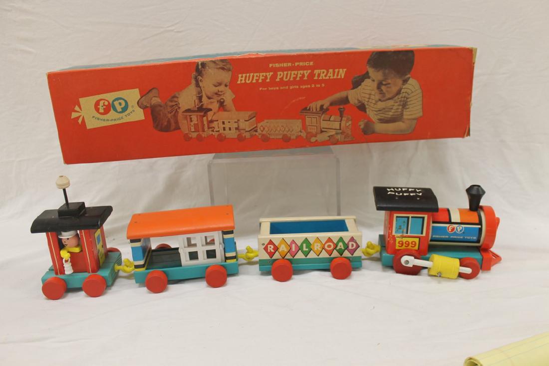Fisher Price Huffy Puffy Railroad, No. 999, c. 1963,: Fisher Price Huffy Puffy Railroad, No. 999, c. 1963, with minor wear, original box. One box tab missing.