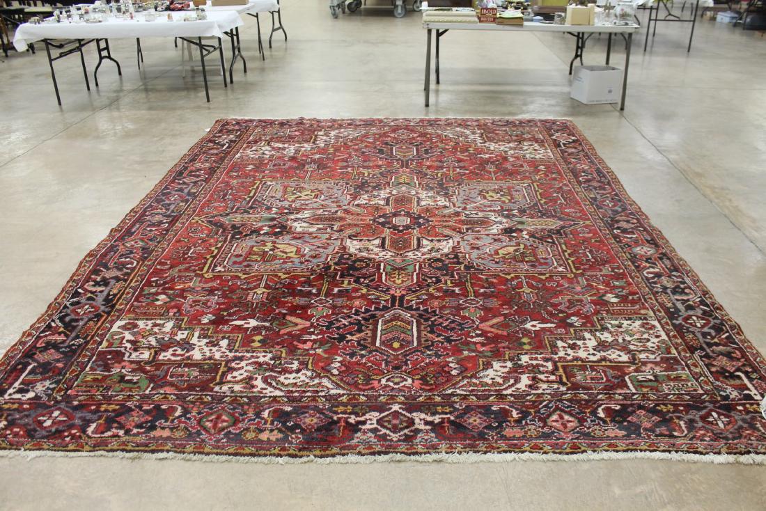 Heriz Persian rug with a red background, app. 9'7" X: Heriz Persian rug with a red background, app. 9'7" X 12'4"