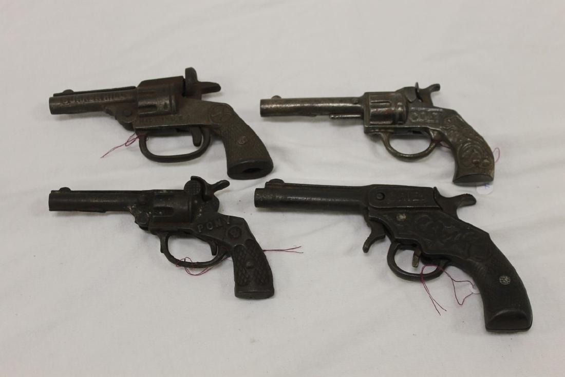 Cast iron cap guns: Stevens "Colt", 5 1/4", c. 1920,: Cast iron cap guns: Stevens "Colt", 5 1/4", c. 1920, Patented June 17, 1890; Kenton "Pony" Mammoth, 5 1/8", Pat. Sept. 11, 23, c. 1930; Kenton "Chief", 6", .22 cal. Blank shooter, with 2nd trigger bel
