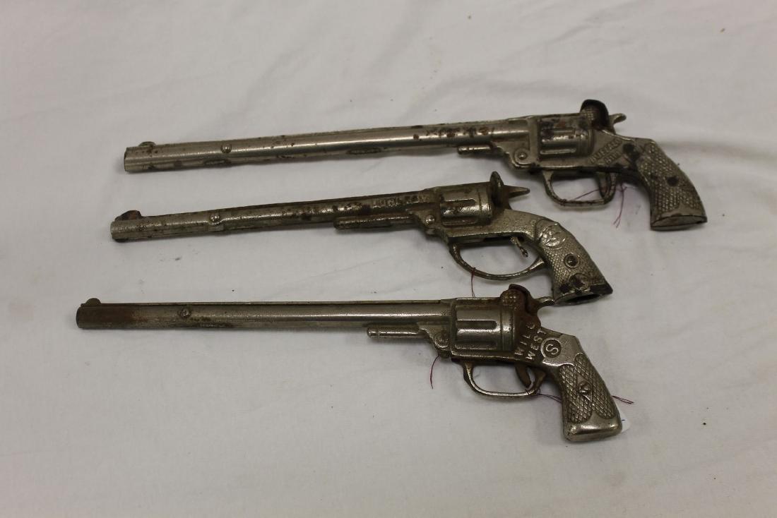 Cast iron cap guns: Kenton "Buffalo Bill", Mammoth, c.: Cast iron cap guns: Kenton "Buffalo Bill", Mammoth, c. 1930, Pat Sept 11, 23, 13 1/2"; Kilgore "Long Boy", Mammoth, c. 1922, Made is USA, 11", loose firing mechanism; Kenton "Wild West", Mammoth, c. 1