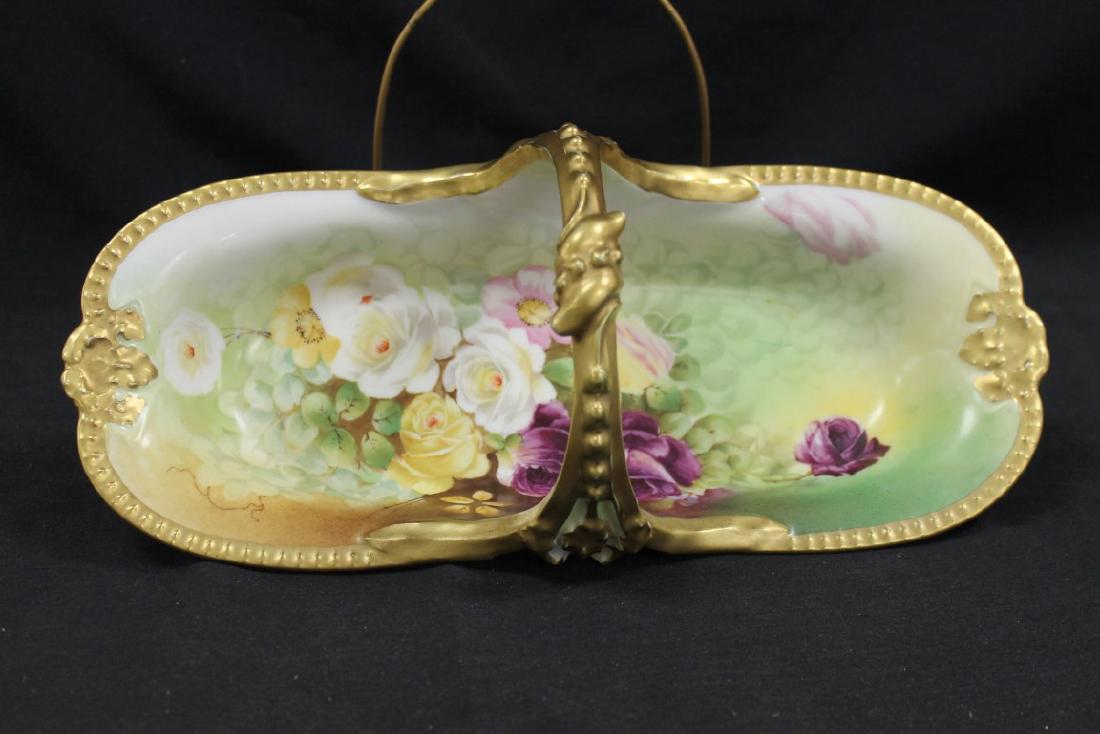 T&V Limoges rose decorated handled celery with gold: T&V Limoges rose decorated handled celery with gold border and handle. Signed Renaud. 13 3/4" long, 5 1/2" tall at handle