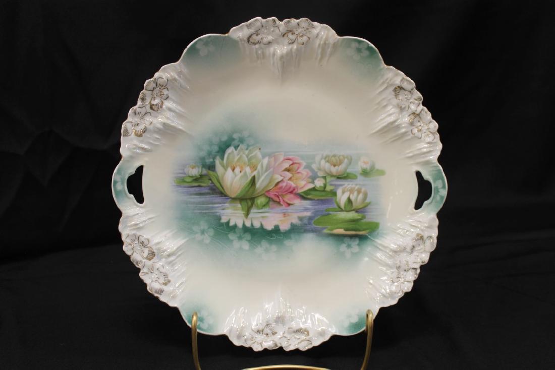 Red Mark RS Prussia Icicly mold plate with reflecting: Red Mark RS Prussia Icicly mold plate with reflecting water lillies, 10", small back rim chip