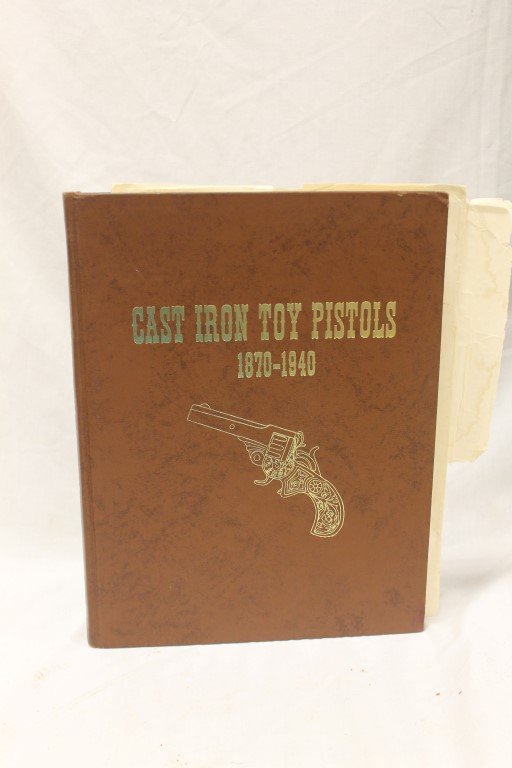 \"Cast Iron Toy Pistols 1870-1940\" by Charles B. West: \"Cast Iron Toy Pistols 1870-1940\" by Charles B. West, 1973 First Edition, signed by author, 1732 of 2000 copies. Includes dust jacket for \"Cast Iron Toy guns and Cap Shooter\" by Samuel H. Logan an
