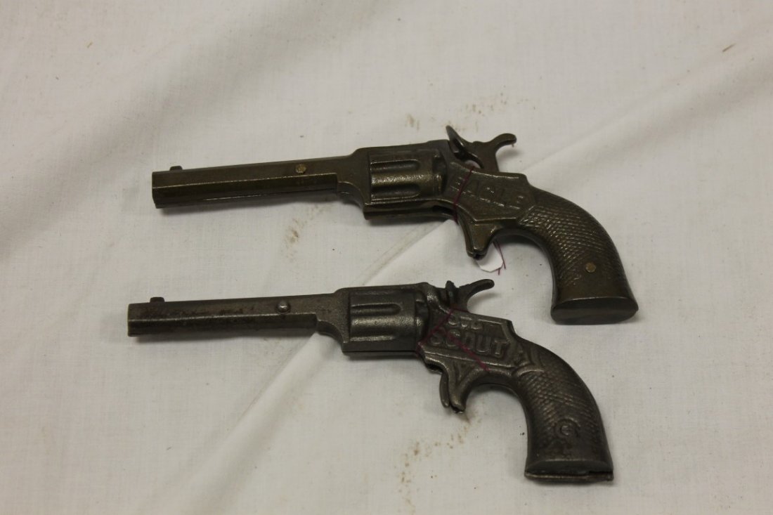 Cap Guns:: Cap Guns: Scout, 6 3/4" - no info found in "Cast Iron Toy Pistols 1870-1940"; Stevens Eagle, 1887, 7", with octagon barrel.