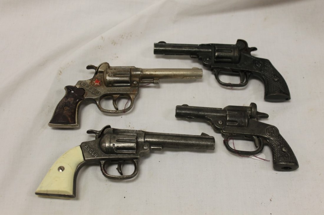 Mammoth Cap and Cap Guns:: Mammoth Cap and Cap Guns: Hubley Rodeo, 1938, 7 1/4", Ranger, 7 1/4", plastic grips, National Oh Boy, 1933, 4 1/8", Kenton Texas, 1936, 5 3/4'