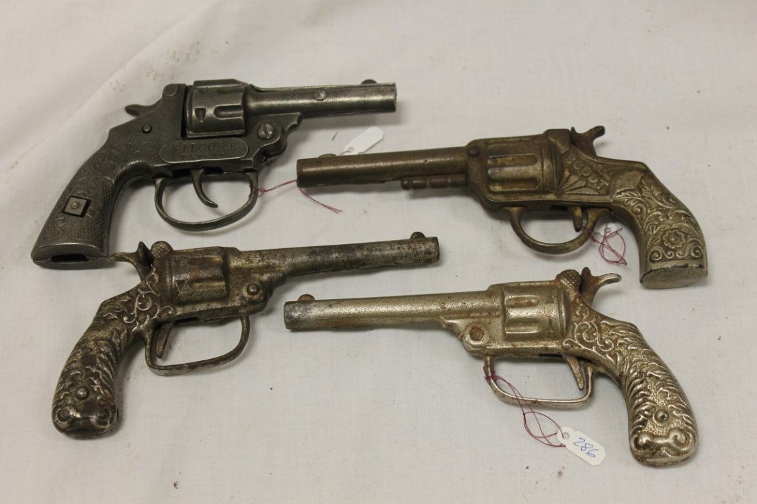 Cap Guns:: Cap Guns: Kilgore Premier Safety, 1914, 6 1/4", Stevens Scout, 1890, 7", (2) Arcade unnamed, 1920, 6 5/8", with rusting