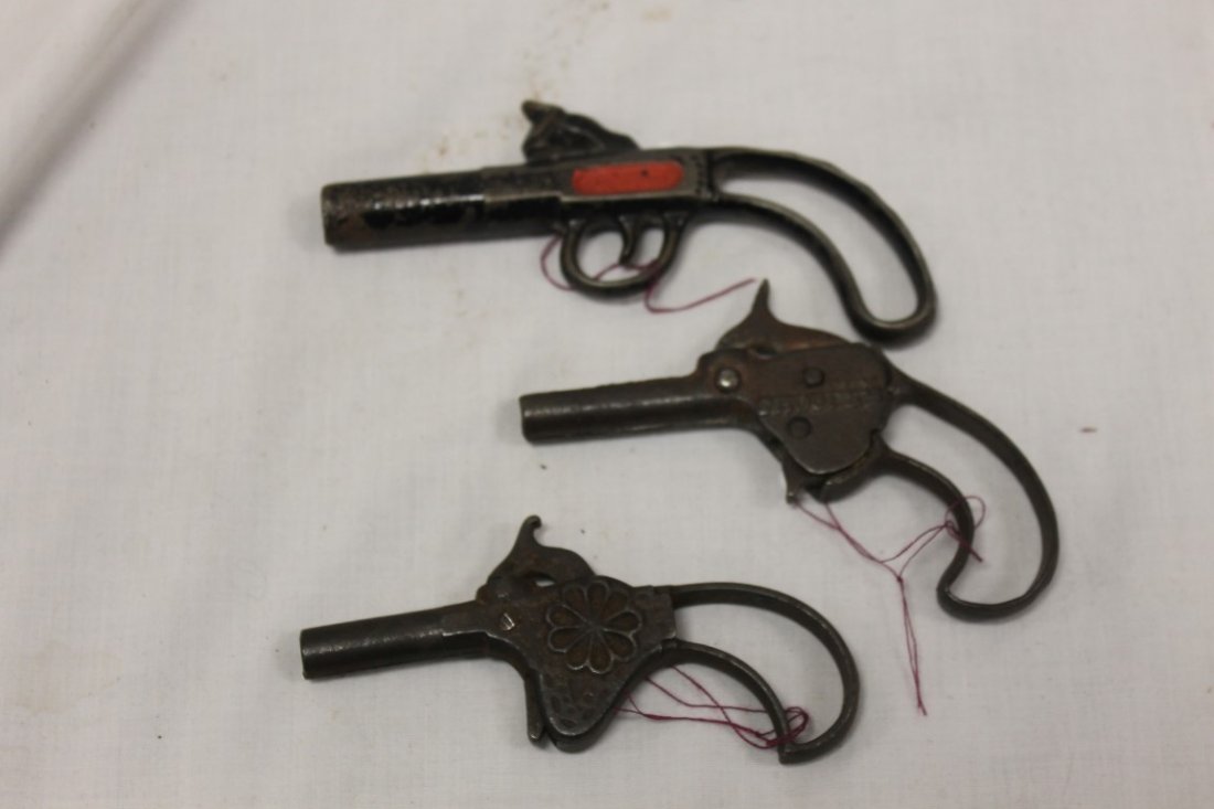 Firecracker and Cap Guns:: Firecracker and Cap Guns: Unknown maker - probably Stevens, Shoofly, 1878, 3 3/4"; Stevens 1872, 4 3/4" Firecracker - no moving parts. To shoot, a firecracker is placed in the end of the barrel.; Stev