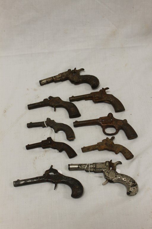 Cap Guns:: Cap Guns: Stevens, 1885, 4 3/4"; Stevens 1882, 4 5/8"; Stevens, 1885, 4 3/4"; (2) Pluck, no firing mechanisms, rust, 1895 and 1930; Cowboy, rusted; Hubley Daisy, 1935, 4 1/8"; Stevens King, 1920, 4 3/