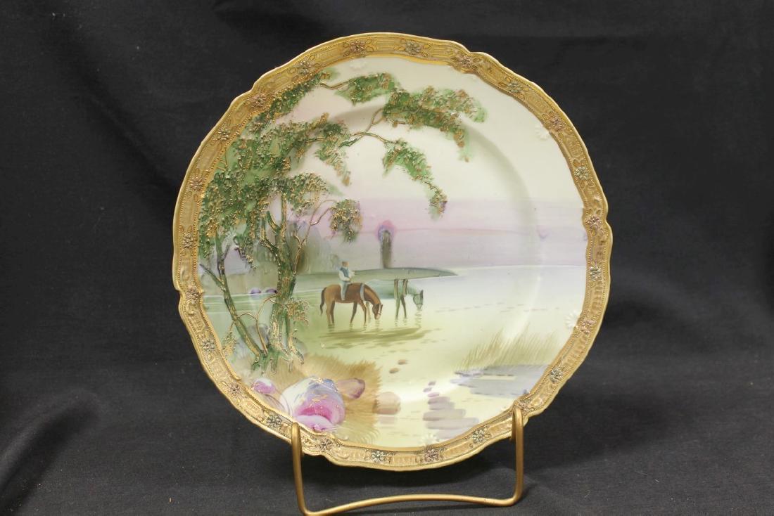 Nippon Green M in wreath plate with heavy raised gold: Nippon Green M in wreath plate with heavy raised gold border, plus raised enamel and gold decoration on trees, with Man on a horse scene, with horses watering at a lake.