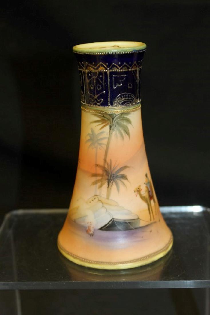 Noritake Made in Japan with Treecrest mark hatpin: Noritake Made in Japan with Treecrest mark hatpin holder with cobalt and gold upper band and Man on camel in camp scene, 4 7/8"