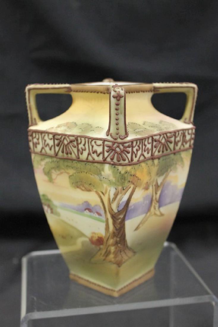 Nippon Green M in wreath 5 3/4" vountry scene vase with: Nippon Green M in wreath 5 3/4" vountry scene vase with moriage trim. Minor bead loss.
