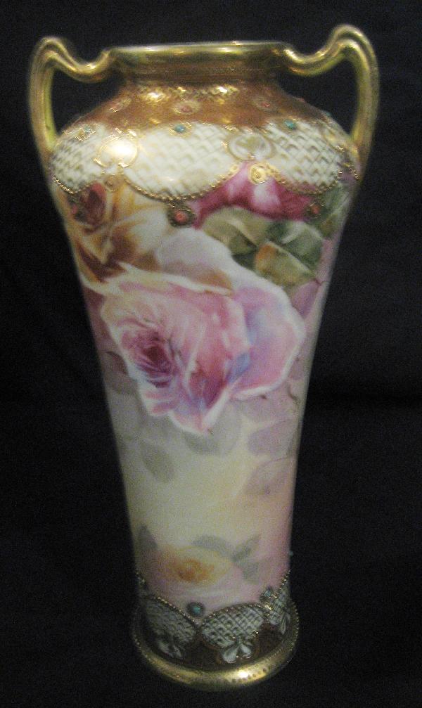 Nippon Blue maple leaf 10" satin finish 2-handle: Nippon Blue maple leaf 10" satin finish 2-handle rose decorated vase with heavy gold and jewel decoration. Minor gold wear.