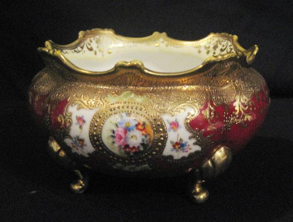Nippon Blue maple leaf gold and floral decorated : Nippon Blue maple leaf gold and floral decorated footed bowl with deep maroon ground and enamel medallions.