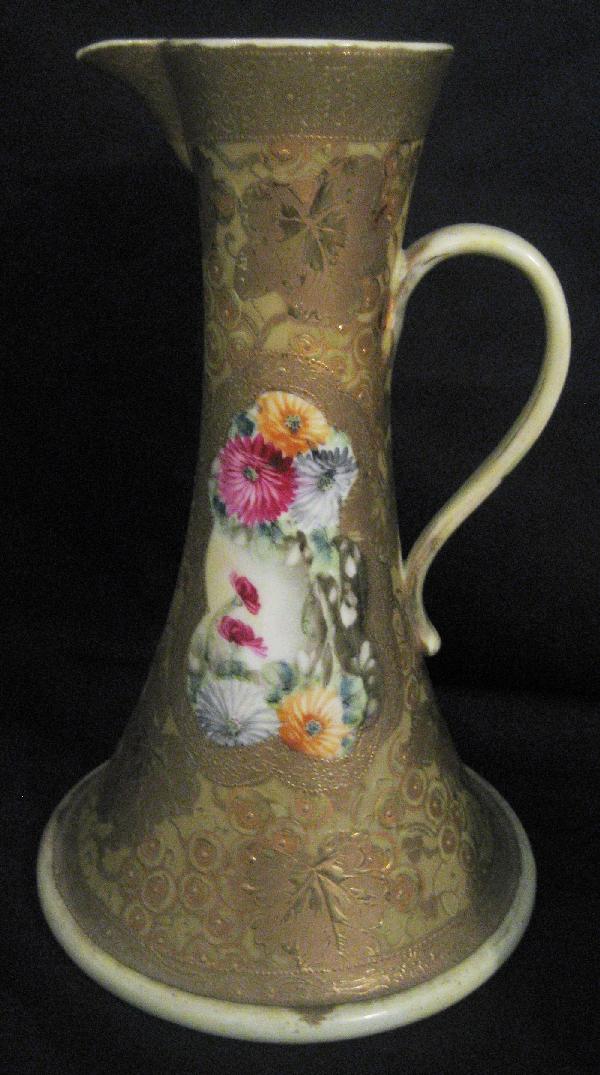 Nippon Blue maple leaf 9 1/2" gold and enamel dec: Nippon Blue maple leaf 9 1/2" gold and enamel decorated ewer with grape and leaf background. Minor gold wear.